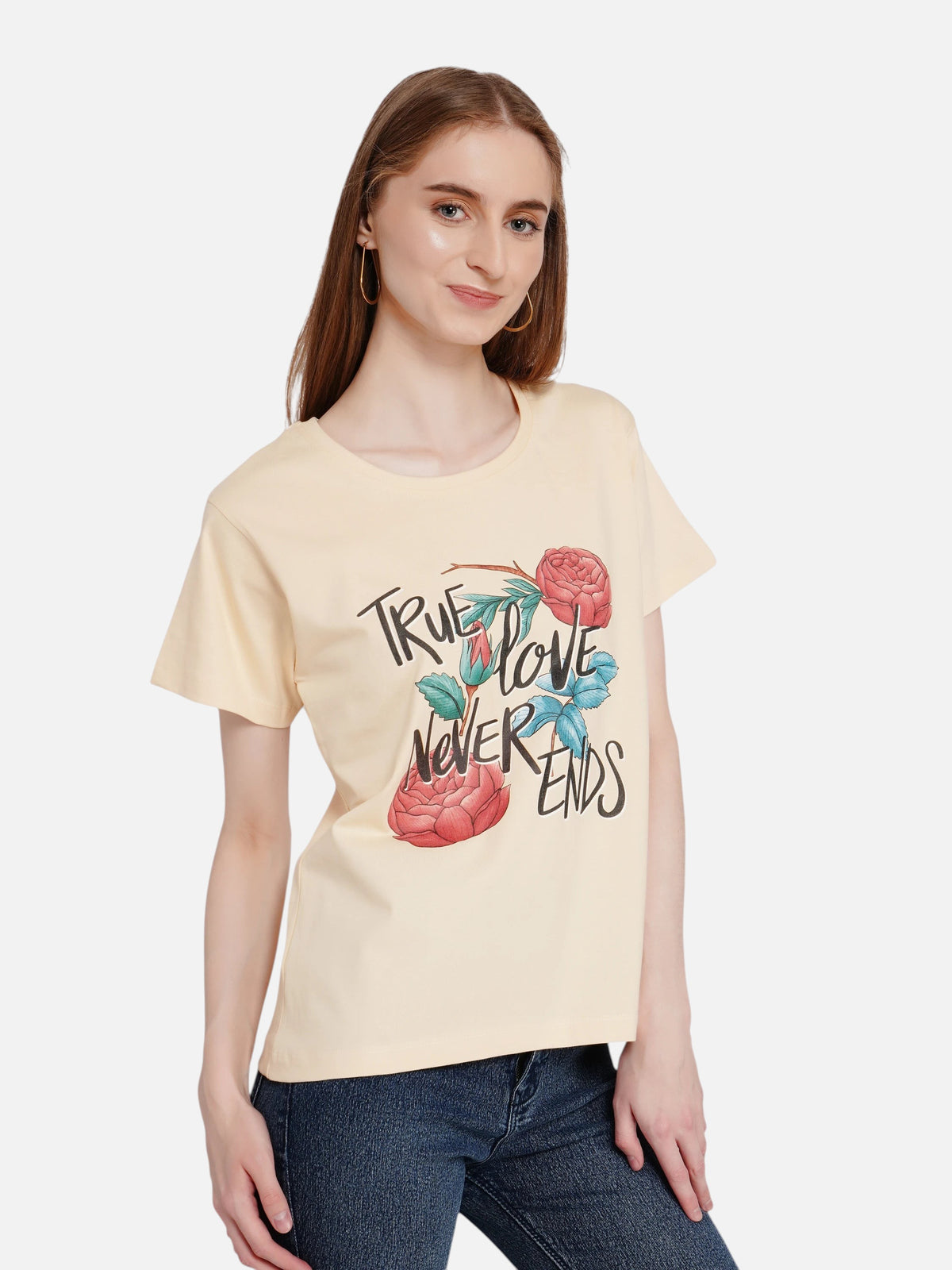 Woman wearing an enaay.com beige crew-neck cotton t-shirt with True Love Never Ends floral graphic print