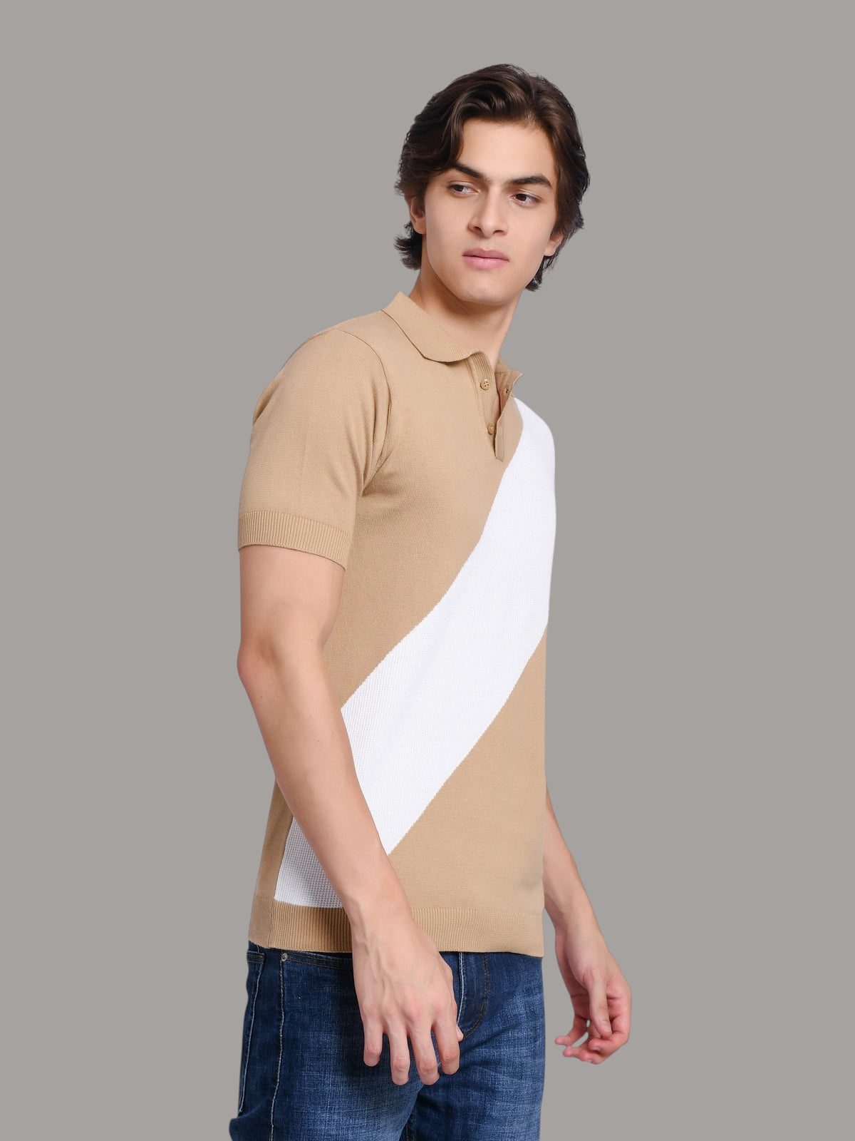 Model wearing an enaay.com beige and white diagonal stripe knit polo shirt with a classic collar and ribbed cuffs.
