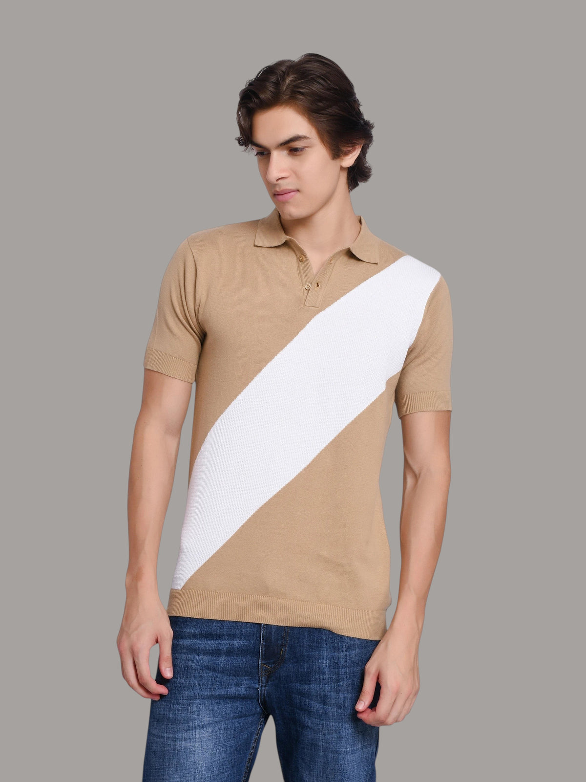 Model wearing an enaay.com beige and white diagonal stripe knit polo shirt with a classic collar and ribbed cuffs.
