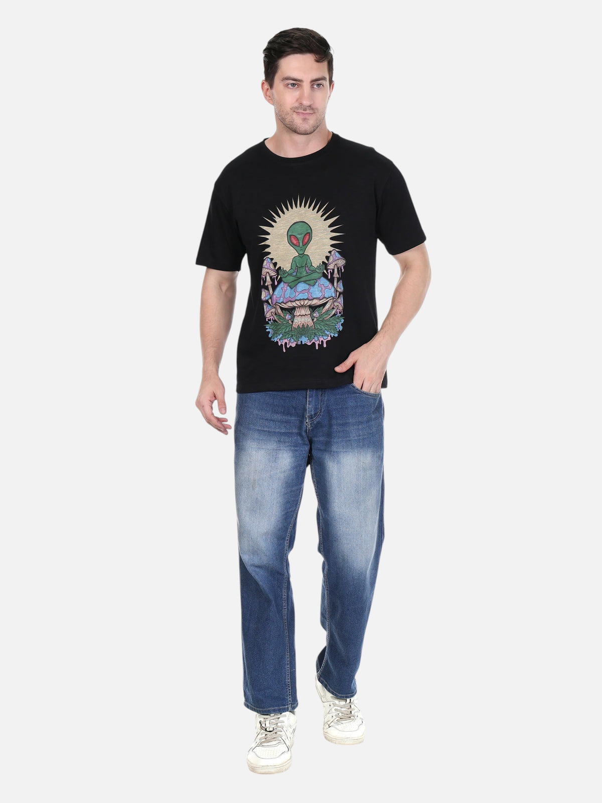 Model wearing an enaay.com black cotton t-shirt with a psychedelic meditating alien and mushroom graphic print.