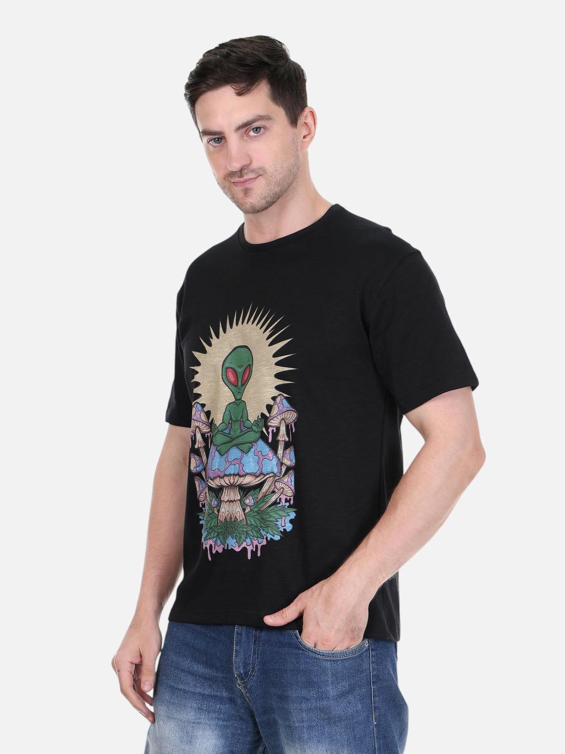 Model wearing an enaay.com black cotton t-shirt with a psychedelic meditating alien and mushroom graphic print.