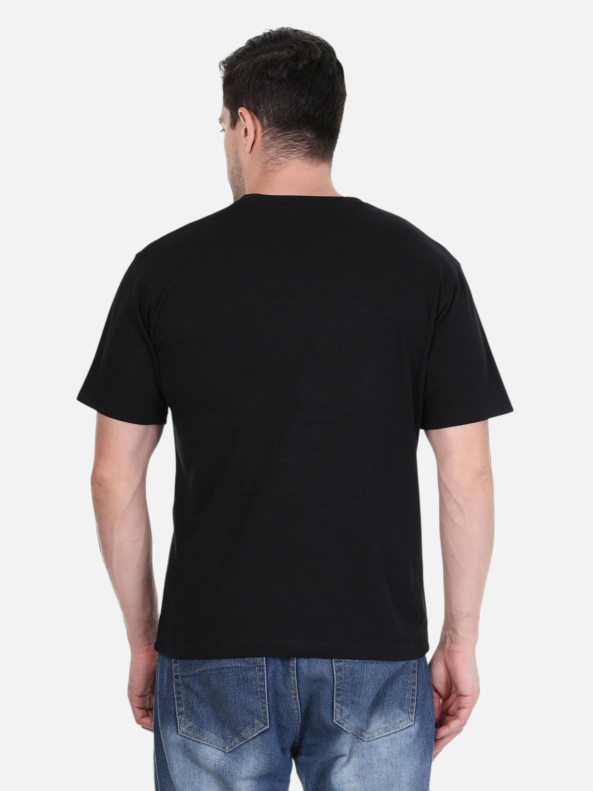 Back view of a man wearing an enaay.com black regular fit cotton crew neck t-shirt with blue jeans