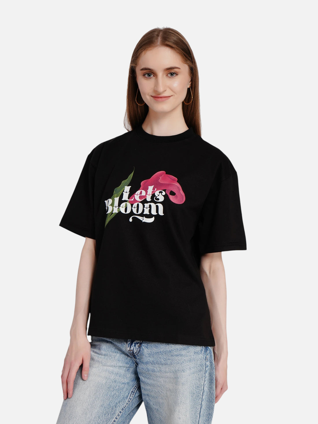 enaay.com black oversized cotton t-shirt featuring a Let's Bloom floral graphic worn by a woman