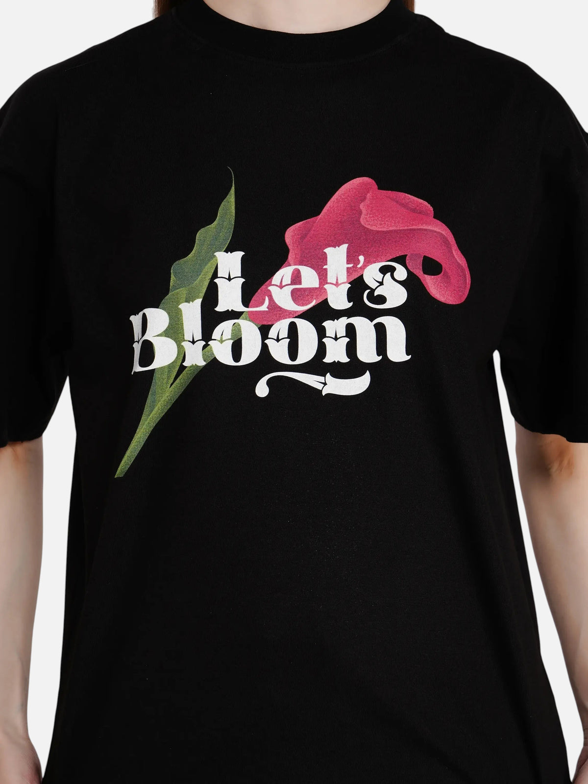 enaay.com black oversized cotton t-shirt featuring a Let's Bloom floral graphic print on the chest