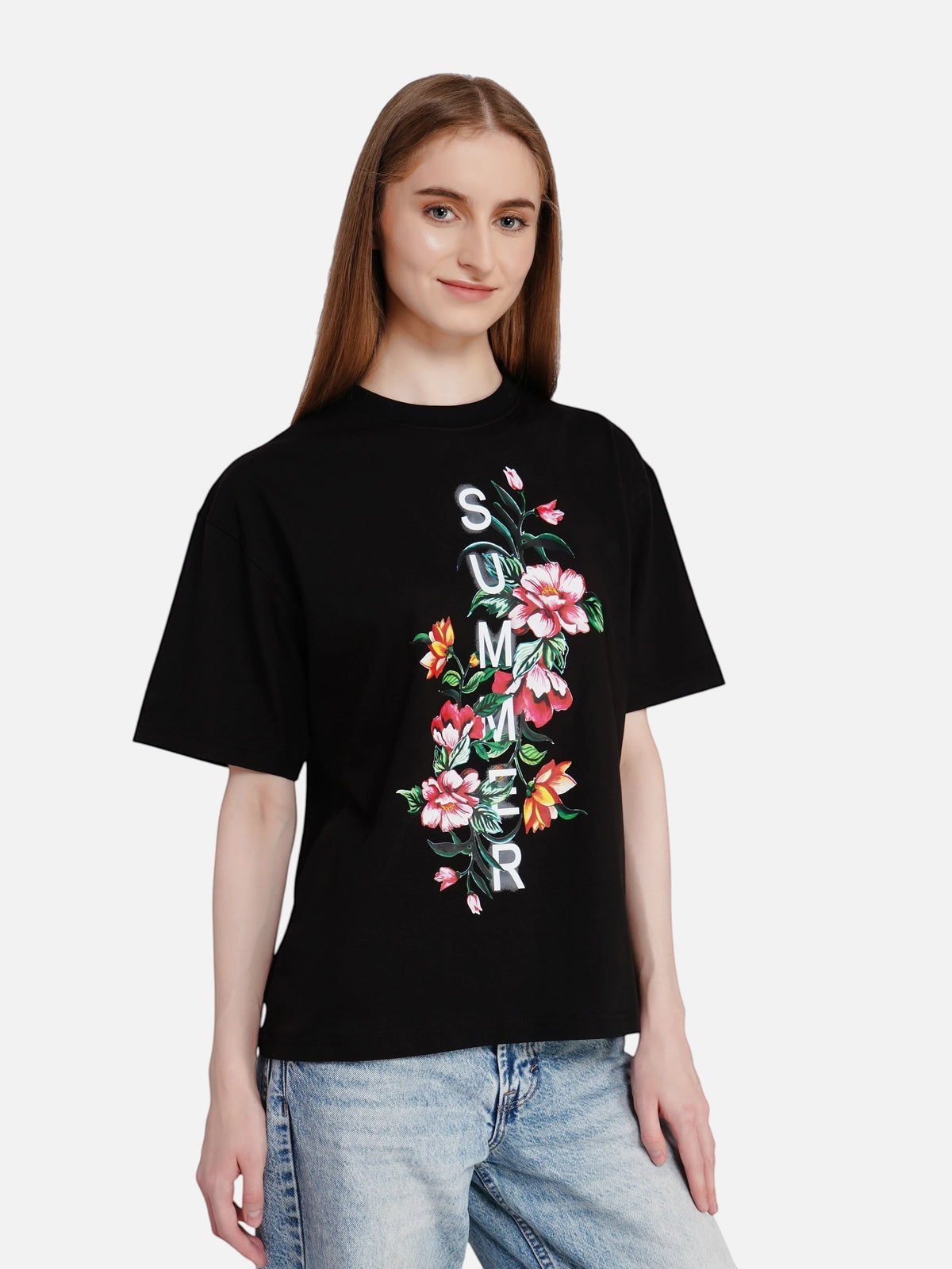 Model wearing an enaay.com black oversized cotton t-shirt with a floral summer graphic print and drop shoulders.