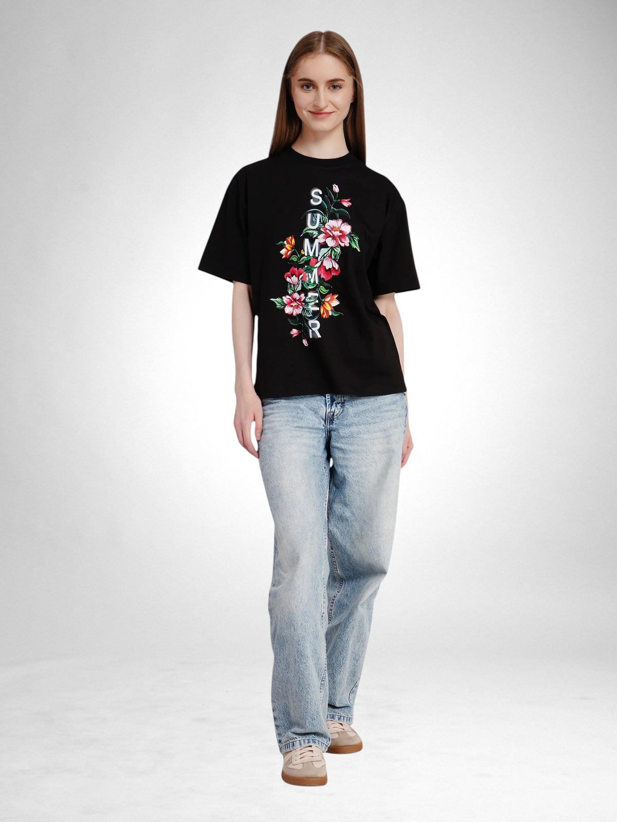 Model wearing an enaay.com black oversized cotton t-shirt with a floral summer print and drop-shoulder fit