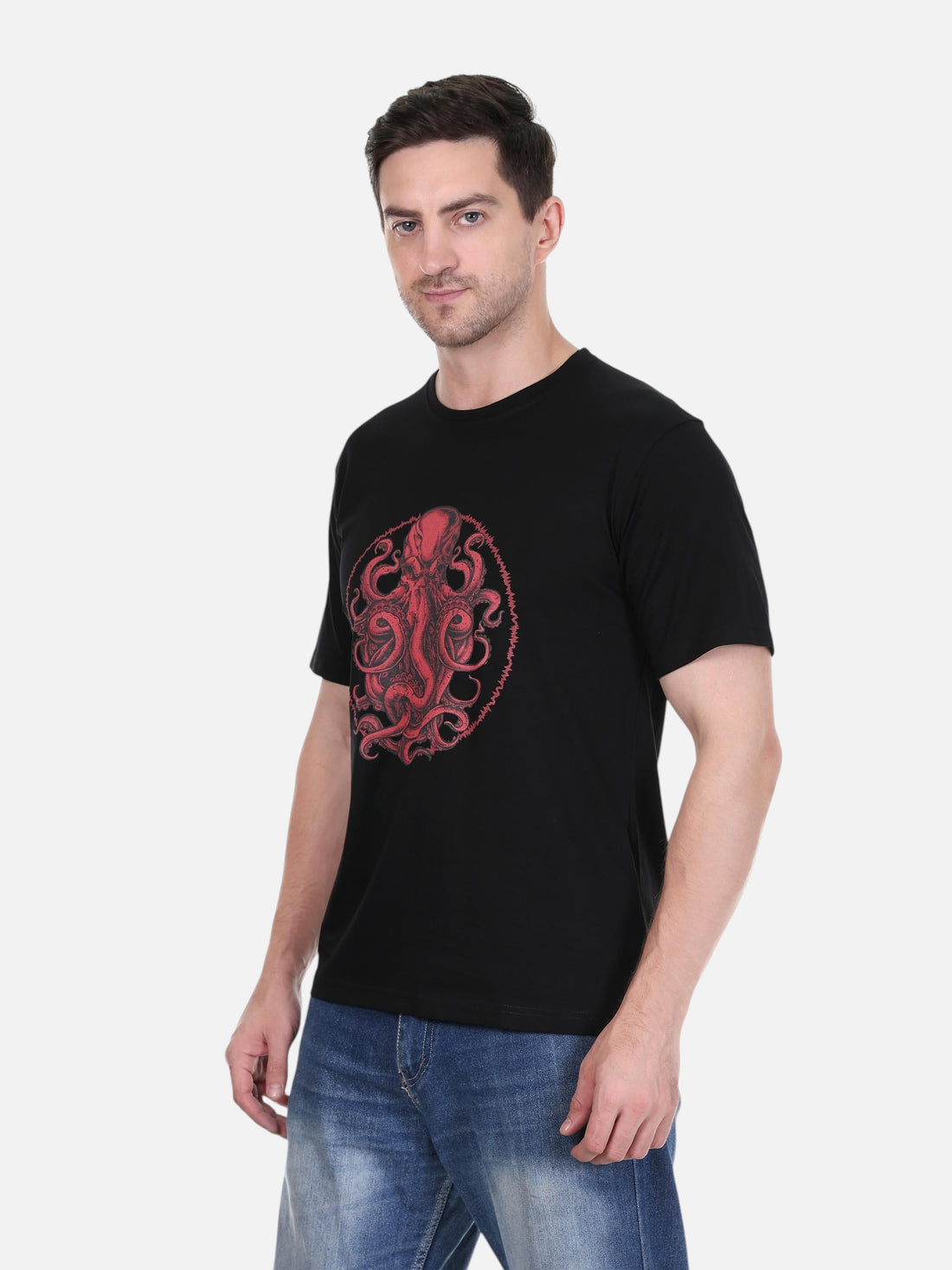 A man wearing an enaay.com black cotton round neck t-shirt with a detailed red circular octopus graphic print.