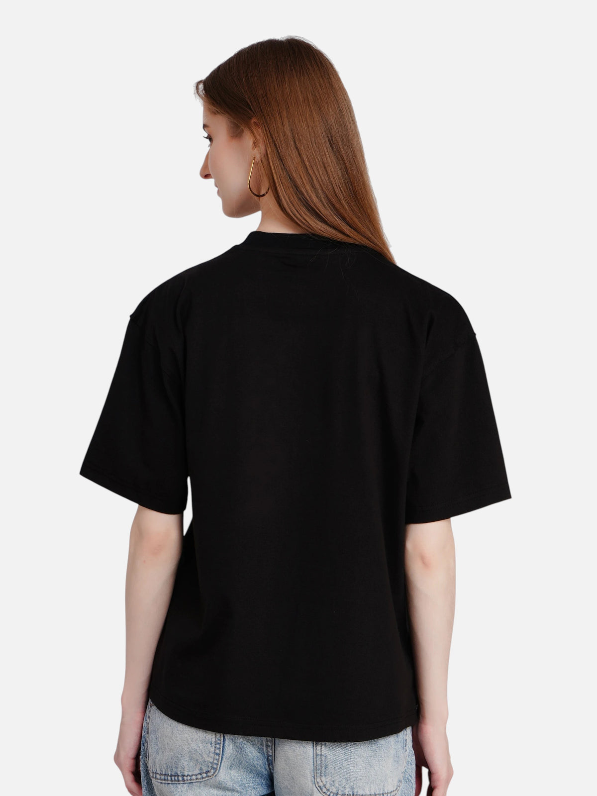Back view of a woman wearing an enaay.com black oversized premium cotton t-shirt with a round neck