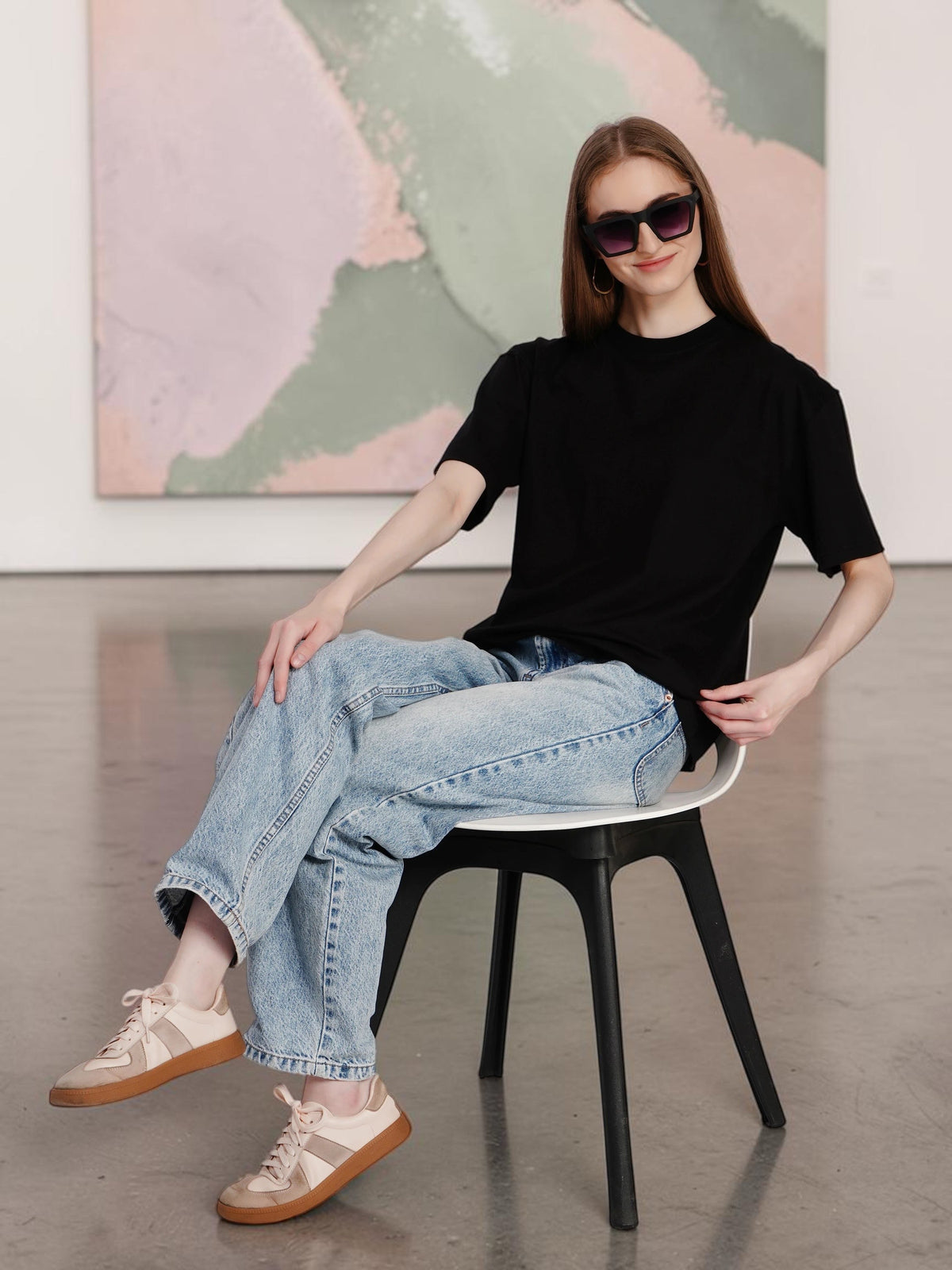 enaay.com women's black oversized drop-shoulder t-shirt in premium heavyweight cotton worn with light wash denim jeans