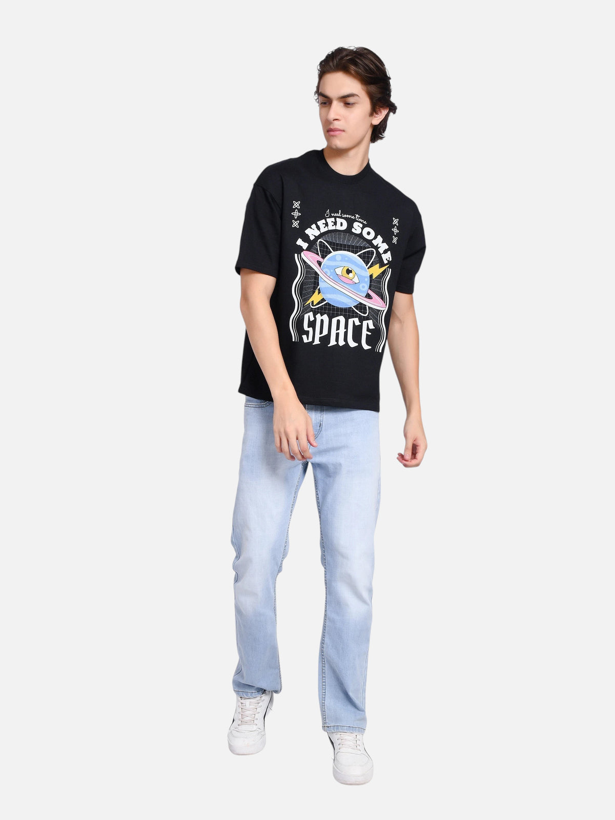 enaay.com men's black oversized t-shirt with cosmic I Need Some Space graphic print, worn with light wash jeans