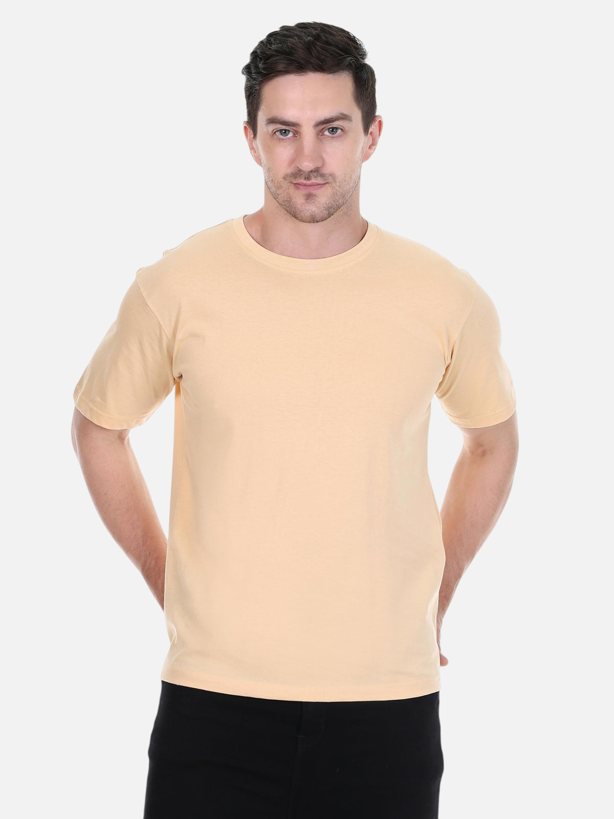 A man wearing an enaay.com camel solid premium cotton crew neck t-shirt with short sleeves and a regular fit.
