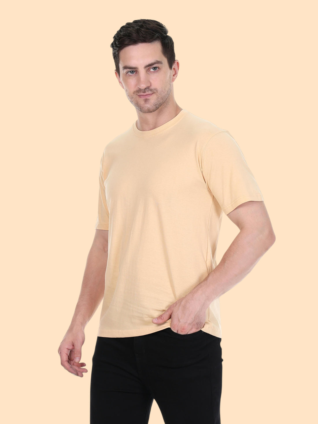 Model wearing an enaay.com camel solid premium cotton crew neck t-shirt with short sleeves and a regular fit
