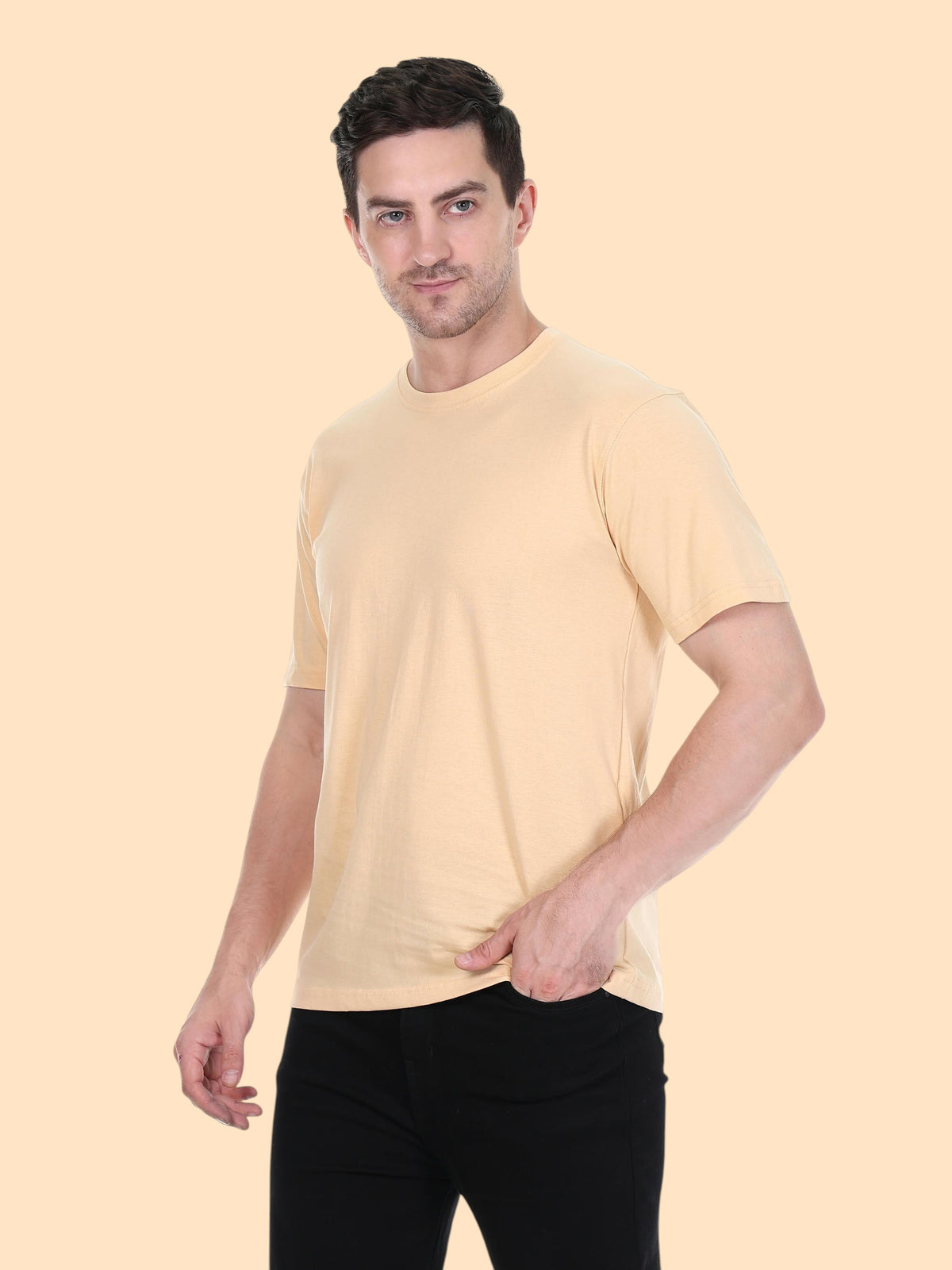 Model wearing an enaay.com camel solid premium cotton crew neck t-shirt with short sleeves and a regular fit
