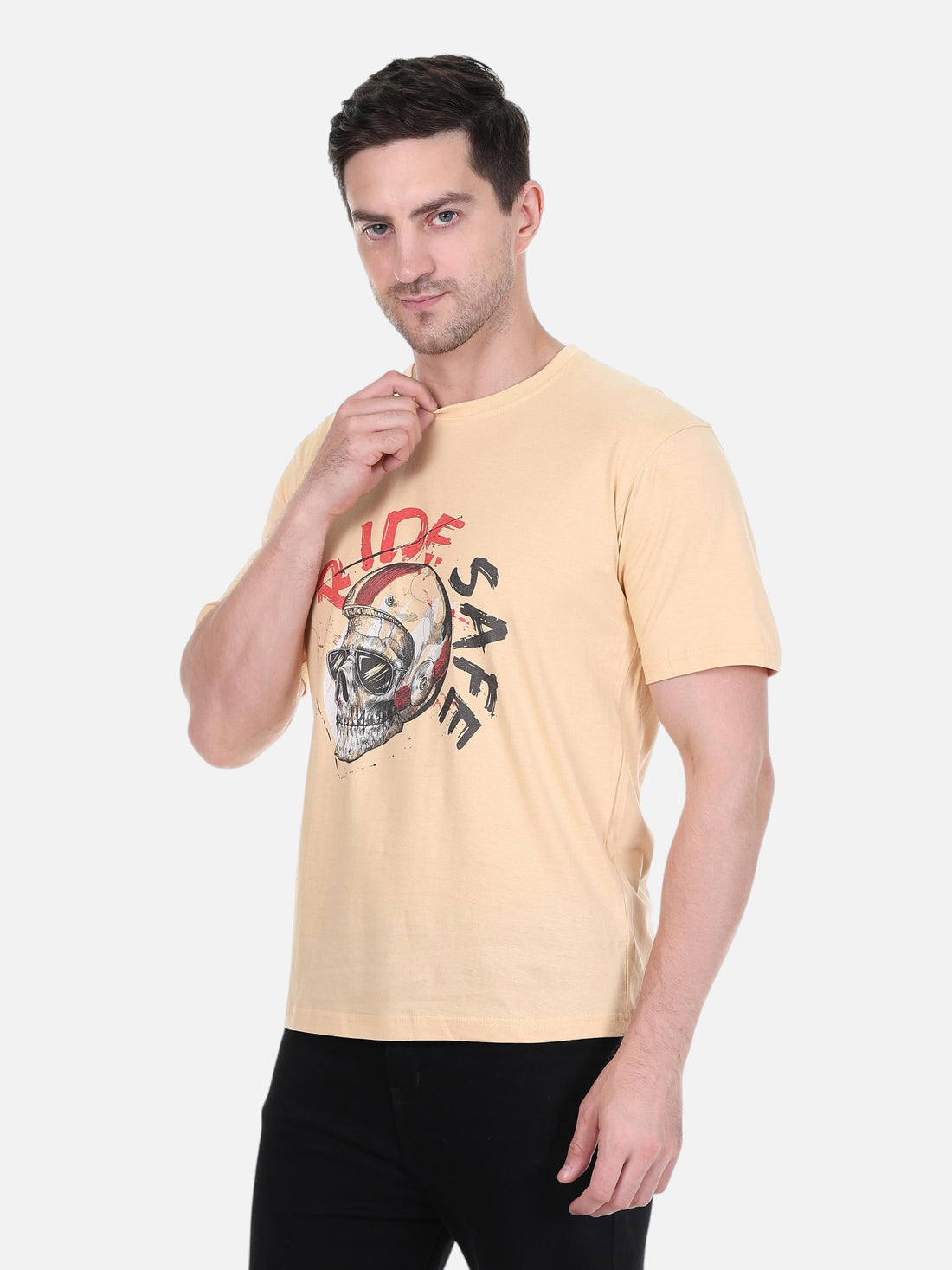 Model wearing an enaay.com camel crew neck t-shirt with a Ride Safe skull biker helmet graphic print.