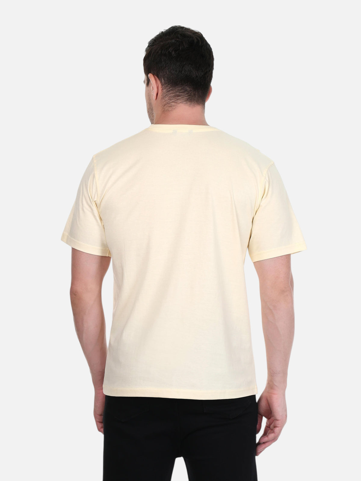 Back view of a man wearing an enaay.com cream premium cotton round neck t-shirt with a regular fit