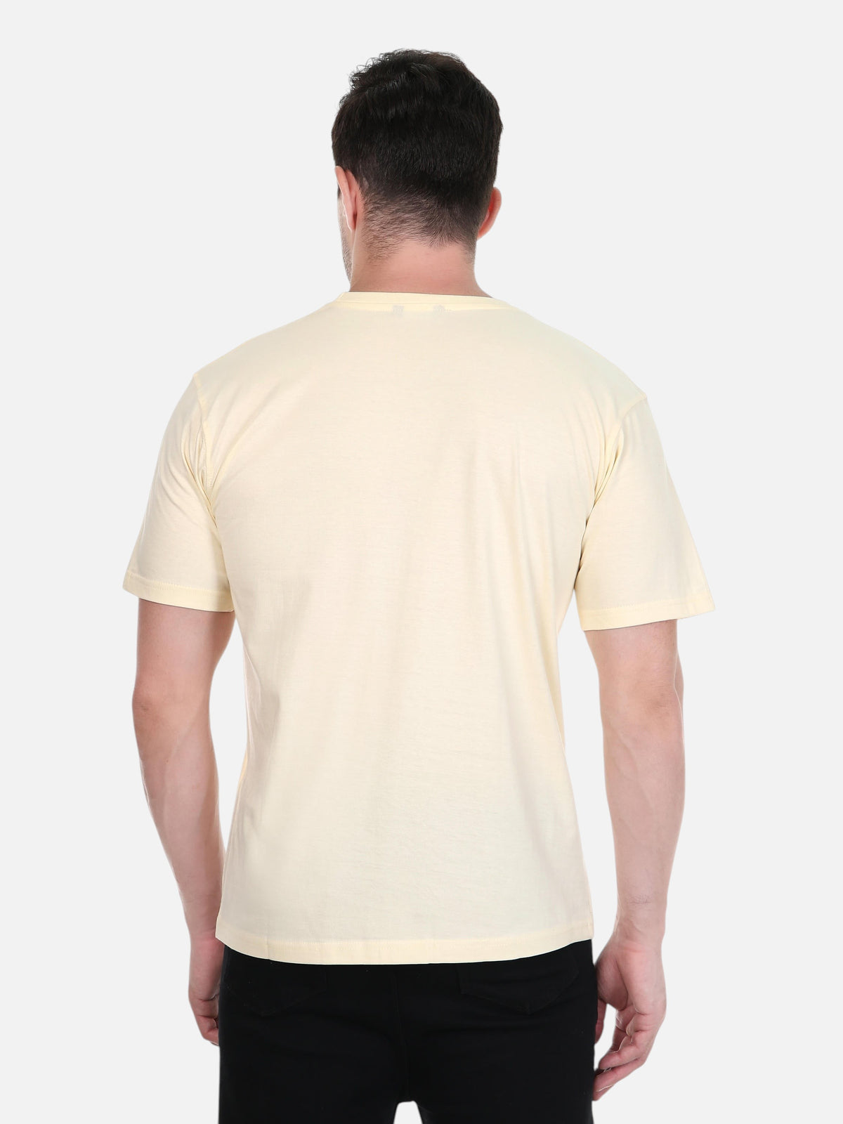 Back view of a man wearing an enaay.com cream-colored premium cotton crew neck t-shirt with a relaxed fit.