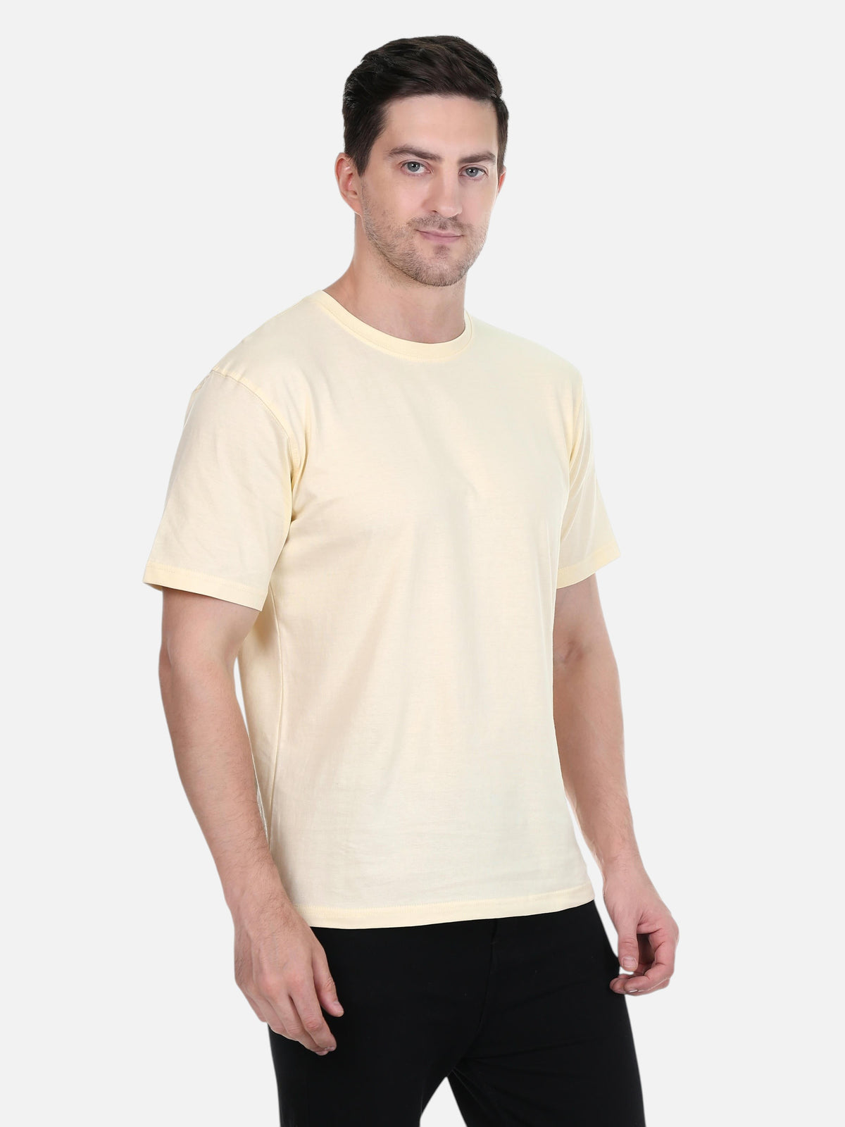 A model wearing an enaay.com cream premium cotton round neck t-shirt with a regular fit against a white background.
