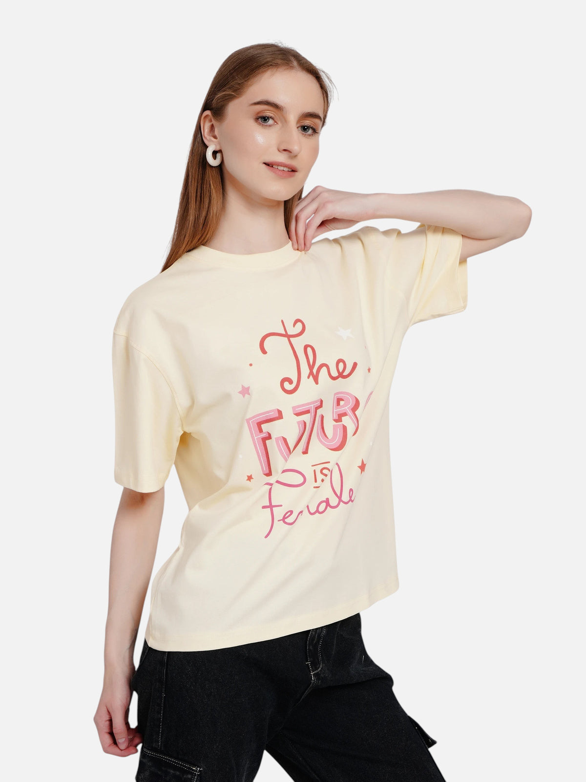Model wearing an enaay.com light cream oversized cotton t-shirt with pink The Future Is Female graphic typography