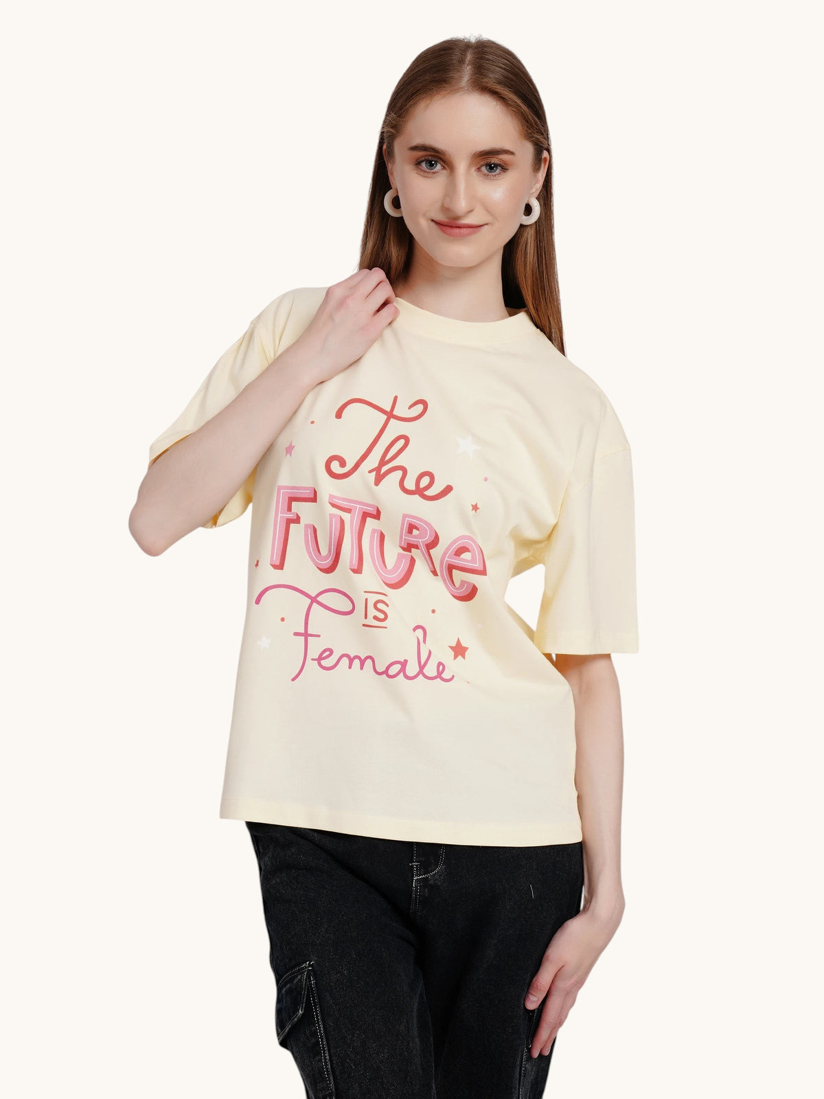 enaay.com light cream oversized cotton t-shirt with pink The Future Is Female graphic print worn by a woman