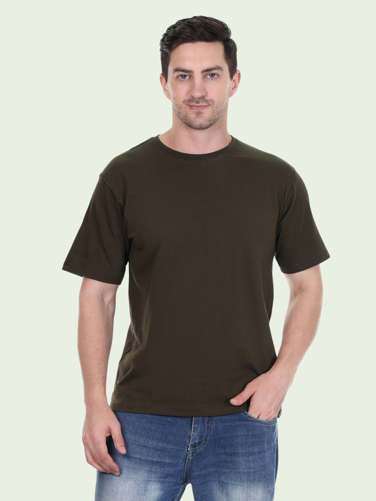 A man wearing an enaay.com dark green premium 200 GSM cotton round neck t-shirt with short sleeves and a relaxed fit.