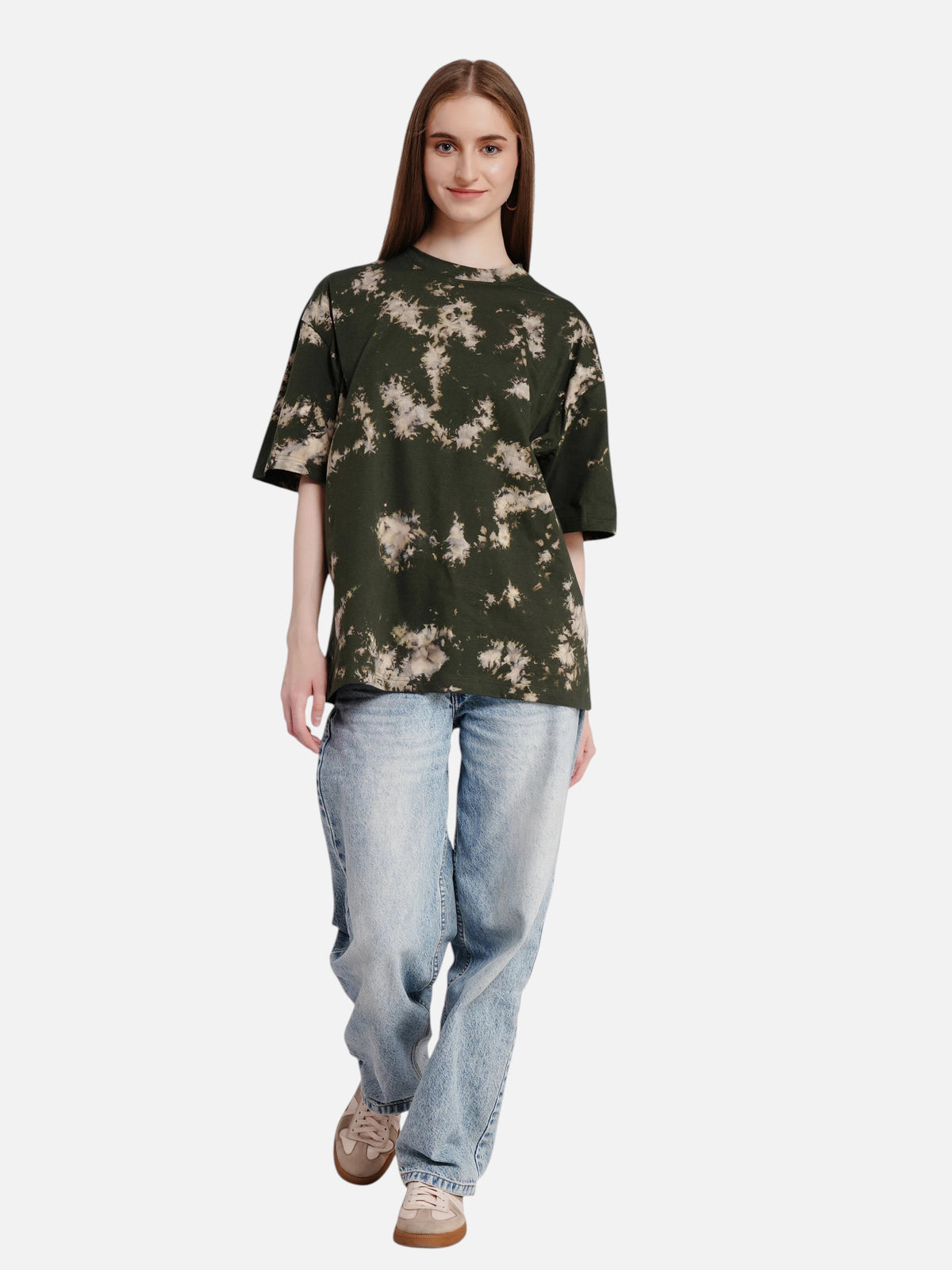 Model wearing an enaay.com dark green oversized tie-dye cotton t-shirt with light wash jeans and sneakers