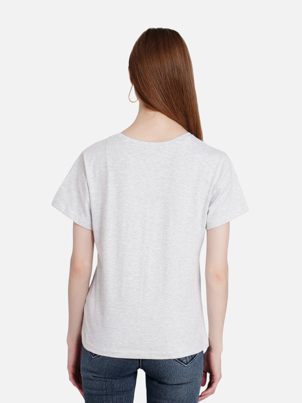 Back view of a woman wearing an enaay.com light grey melange cotton round neck t-shirt with short sleeves.