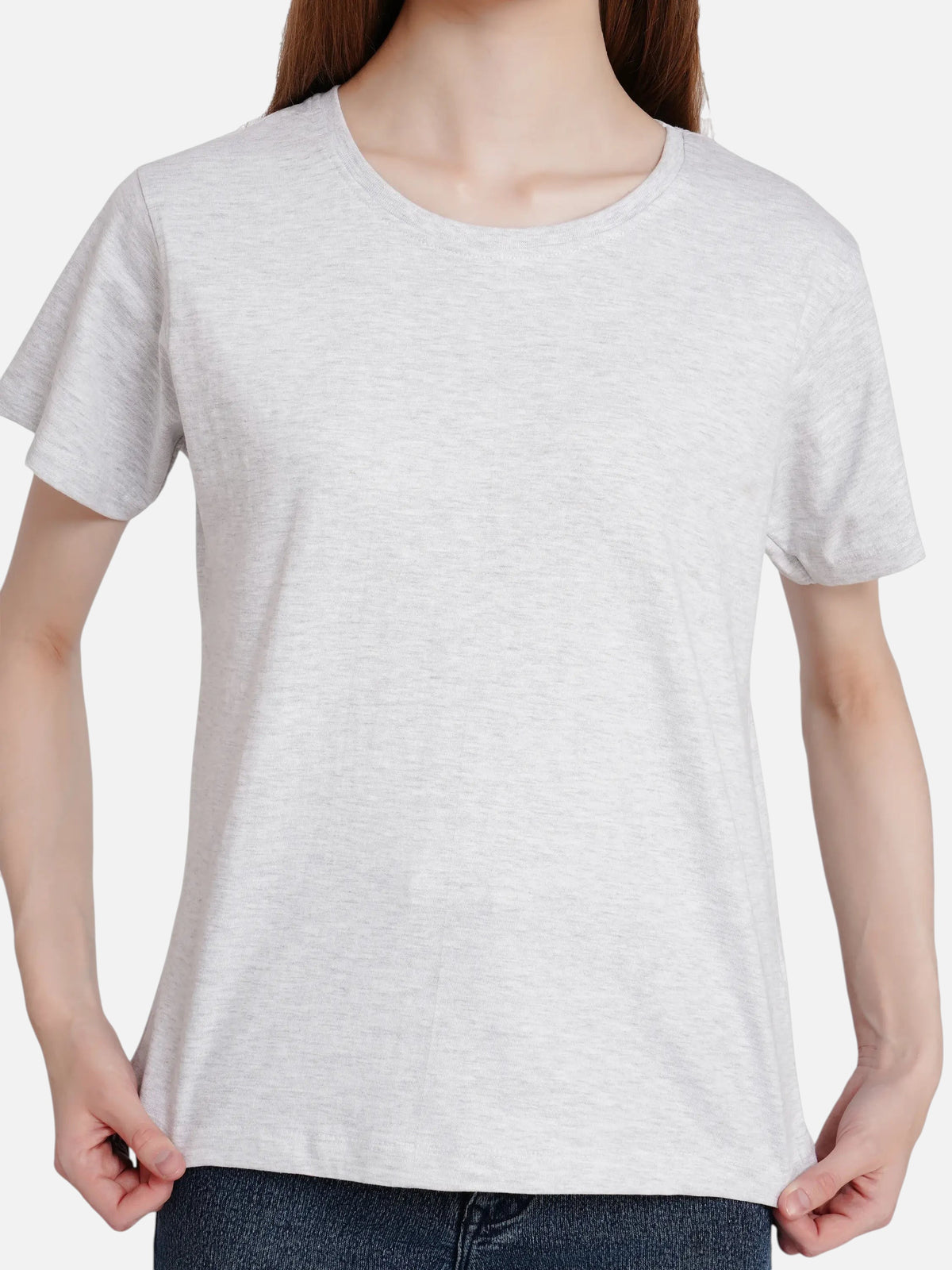Woman wearing an enaay.com light grey melange cotton round neck short sleeve t-shirt with a regular fit