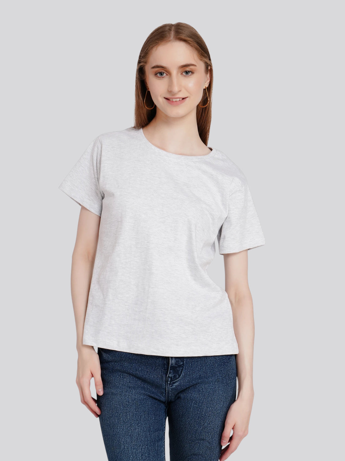 Model wearing an enaay.com light grey melange cotton round neck t-shirt with short sleeves and a regular fit