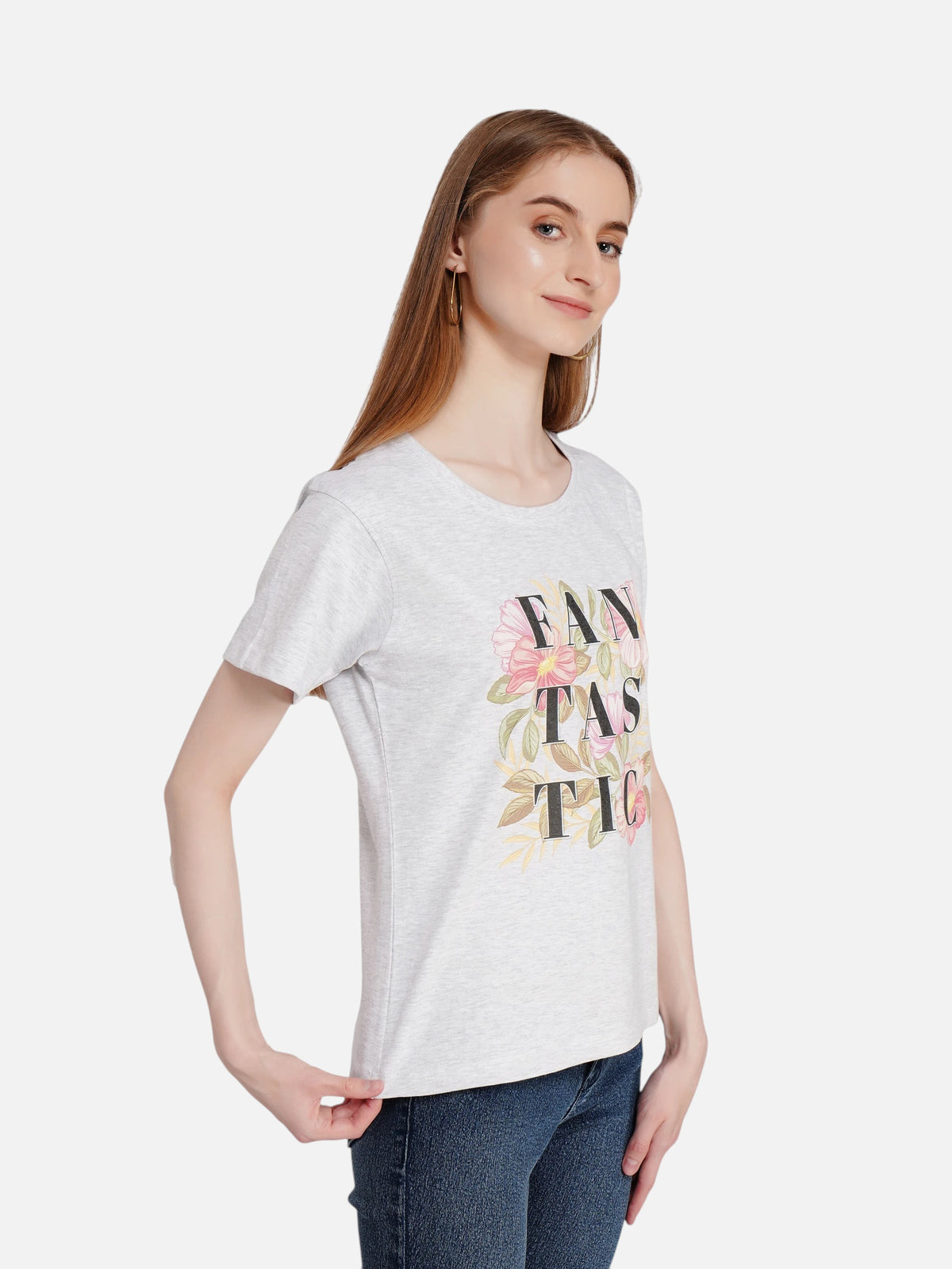 Model wearing an enaay.com light grey melange cotton t-shirt with a floral FANTASTIC graphic print