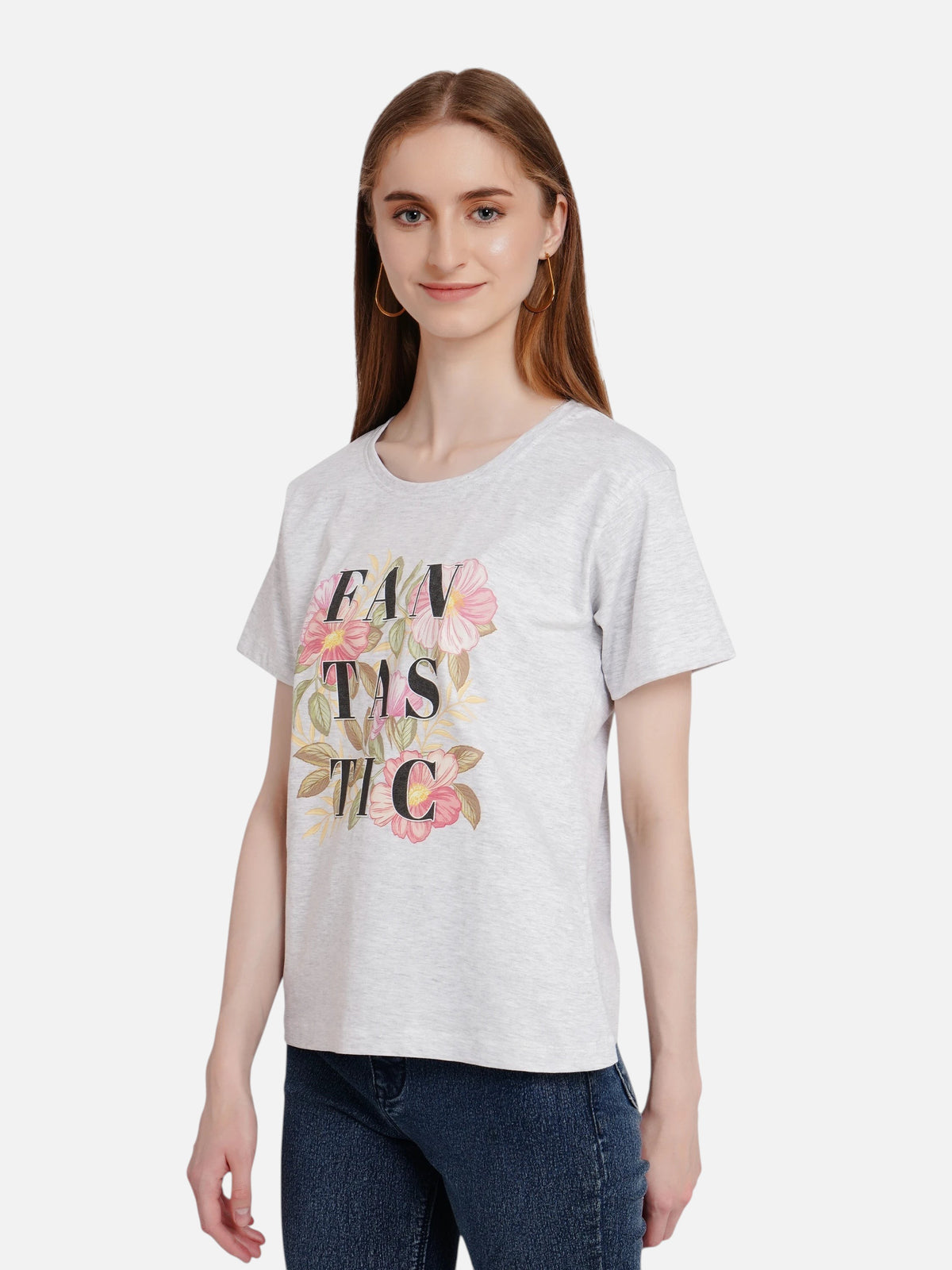 Model wearing an enaay.com light grey melange cotton t-shirt with a FANTASTIC floral graphic print and round neck.