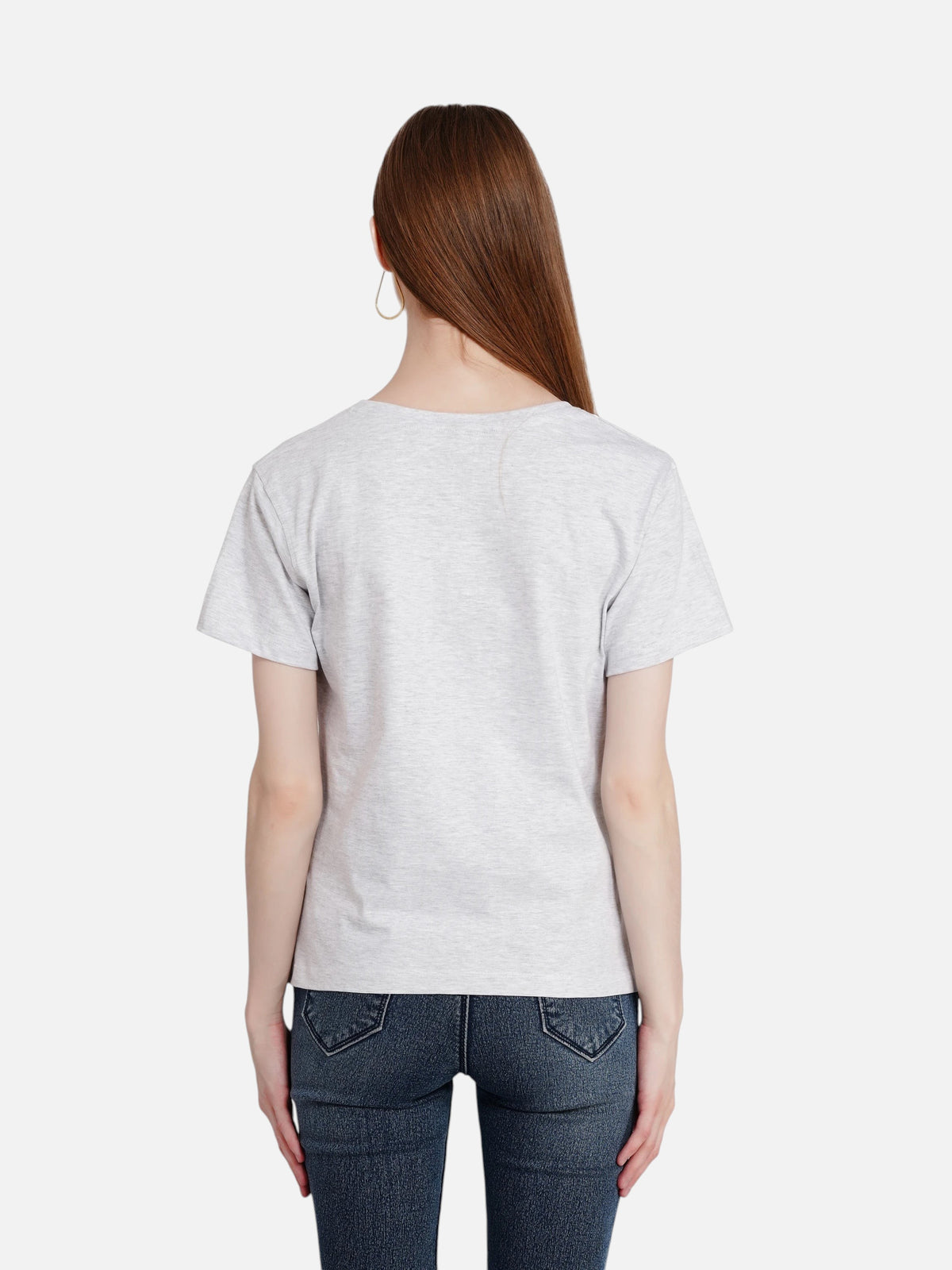 Back view of a woman wearing an enaay.com light grey melange cotton crew neck t-shirt with short sleeves