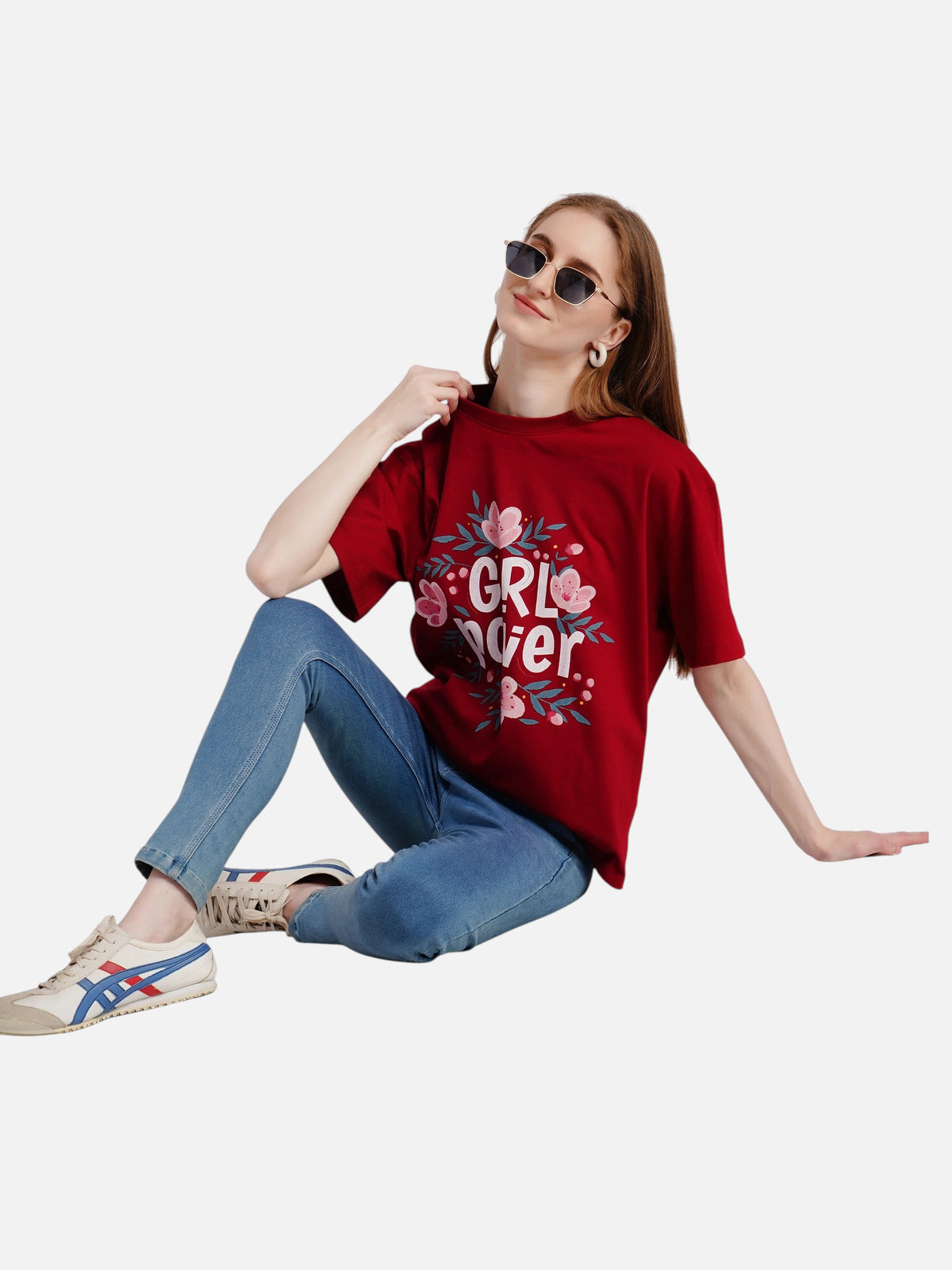 Model wearing an enaay.com maroon oversized cotton t-shirt with a Girl Power floral graphic and blue jeans