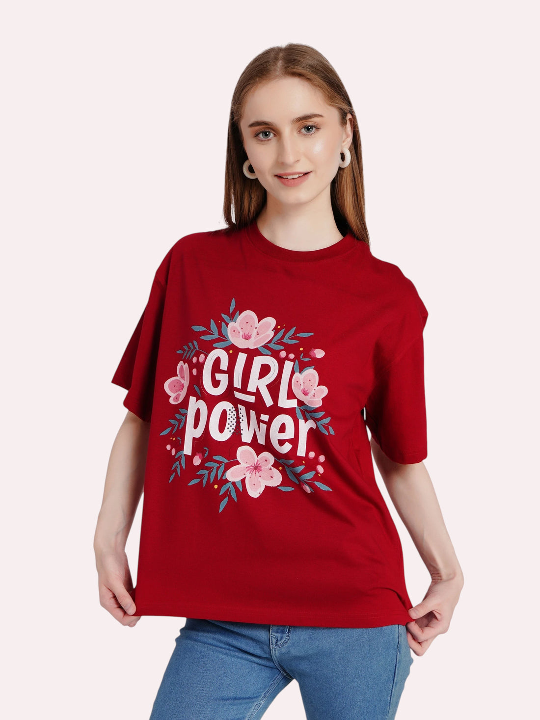 Woman wearing an enaay.com maroon oversized cotton t-shirt with a Girl Power floral graphic print