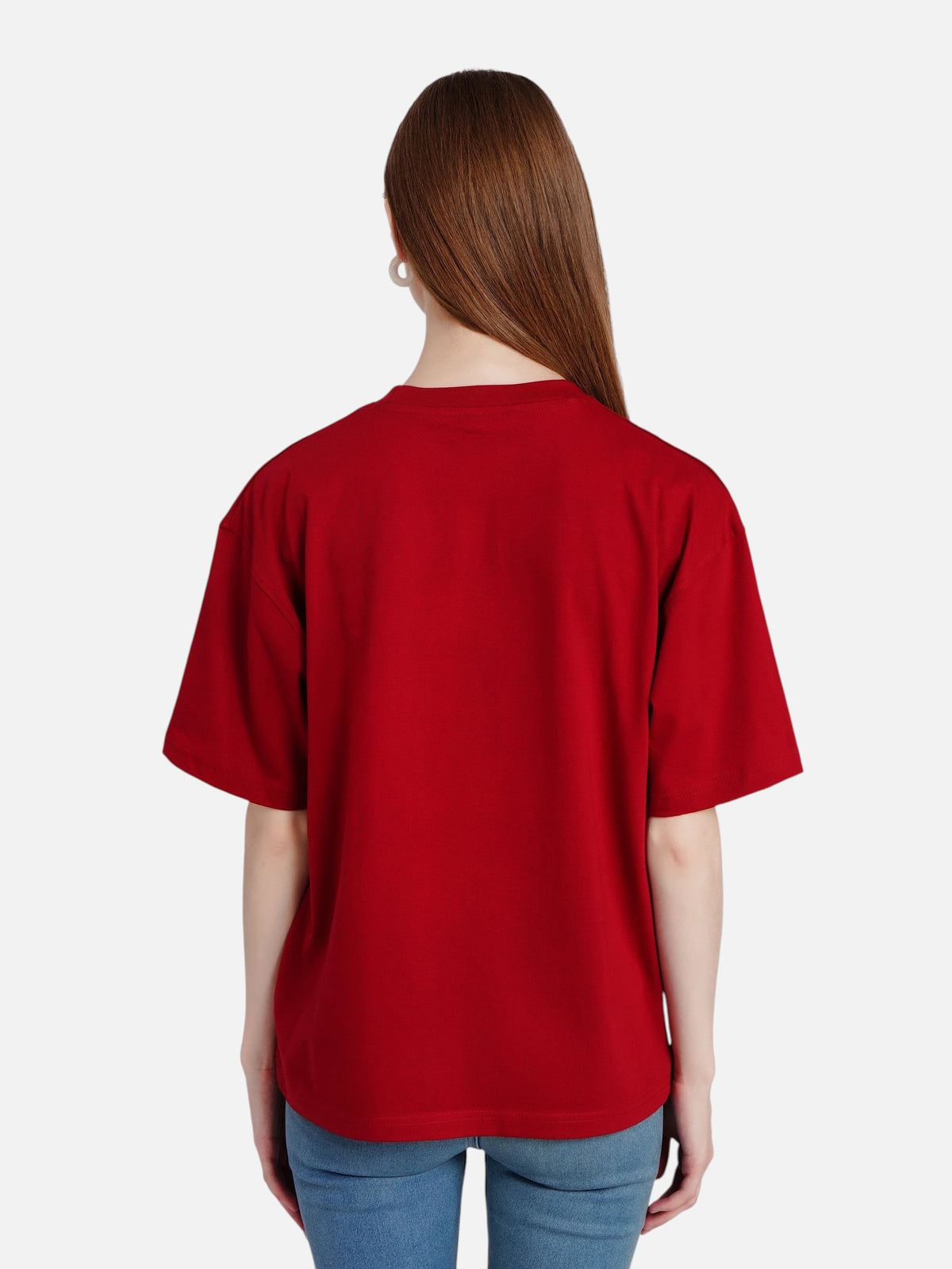 Back view of a woman wearing an enaay.com maroon oversized cotton t-shirt with short sleeves and a crew neck.