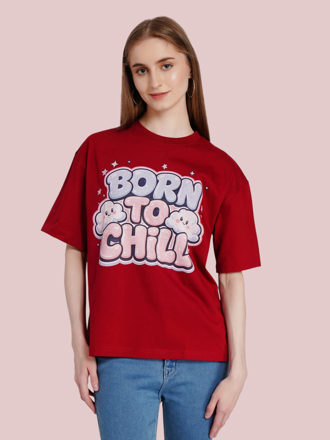 Model wearing an enaay.com maroon oversized cotton t-shirt with Born To Chill bubble letter graphic and cloud icons