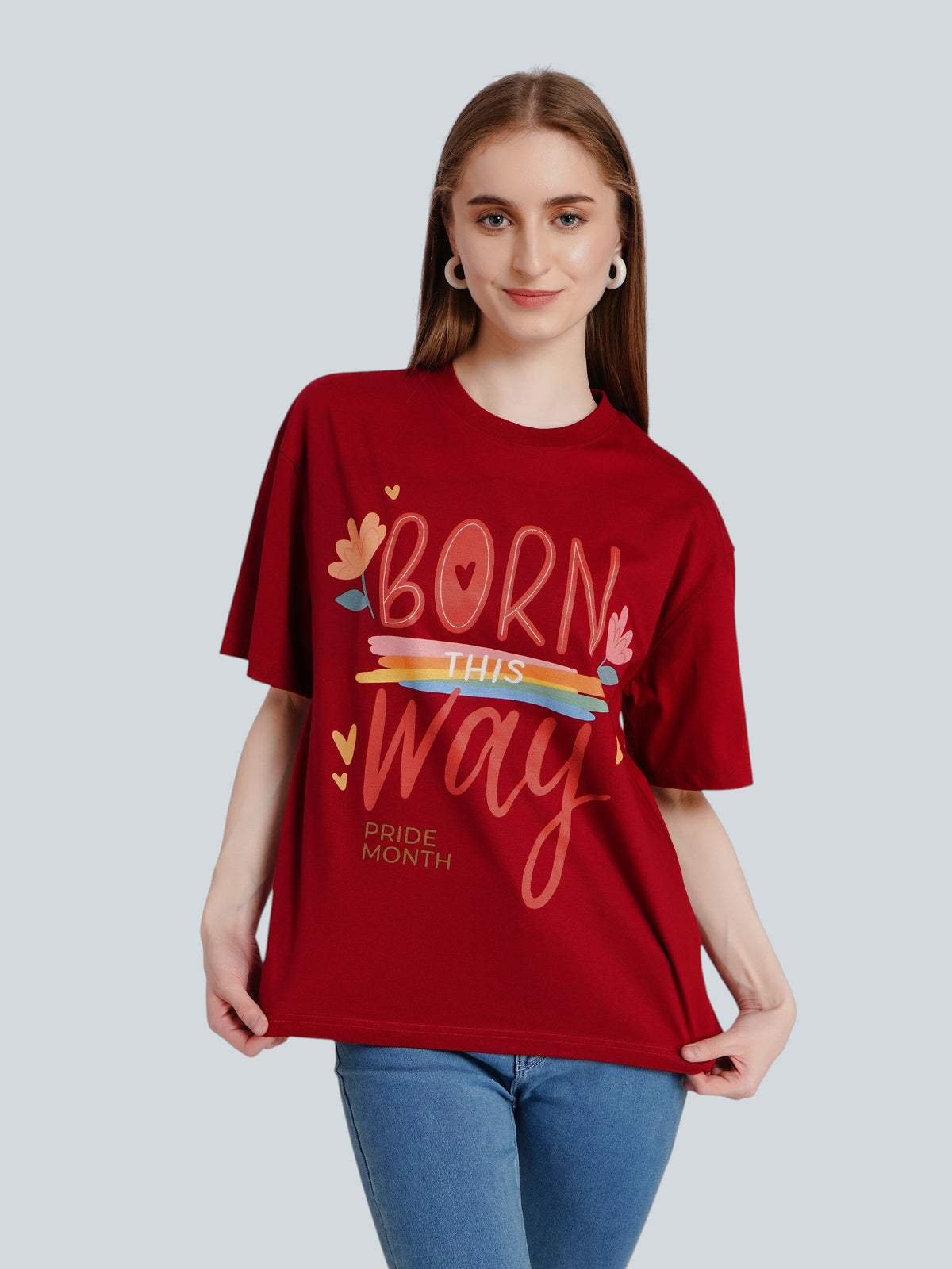 Model wearing an enaay.com maroon oversized cotton t-shirt with Born This Way Pride Month graphic print