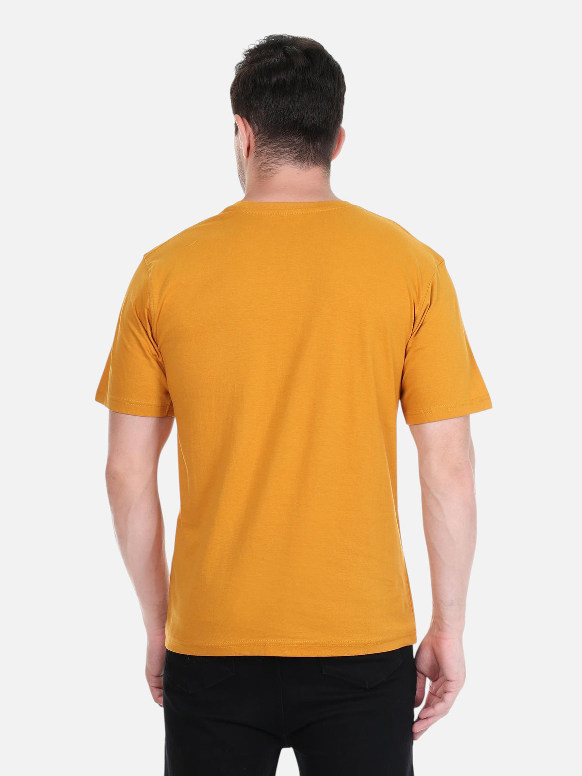 Back view of a man wearing an enaay.com mustard yellow round neck t-shirt in premium cotton with a relaxed fit.