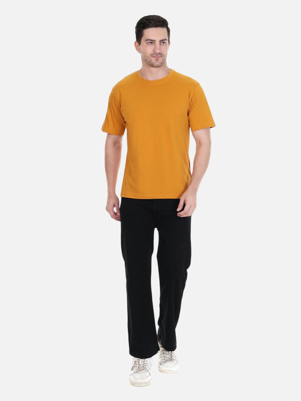 Model wearing an enaay.com mustard yellow round neck t-shirt in premium cotton with a regular fit and black trousers.