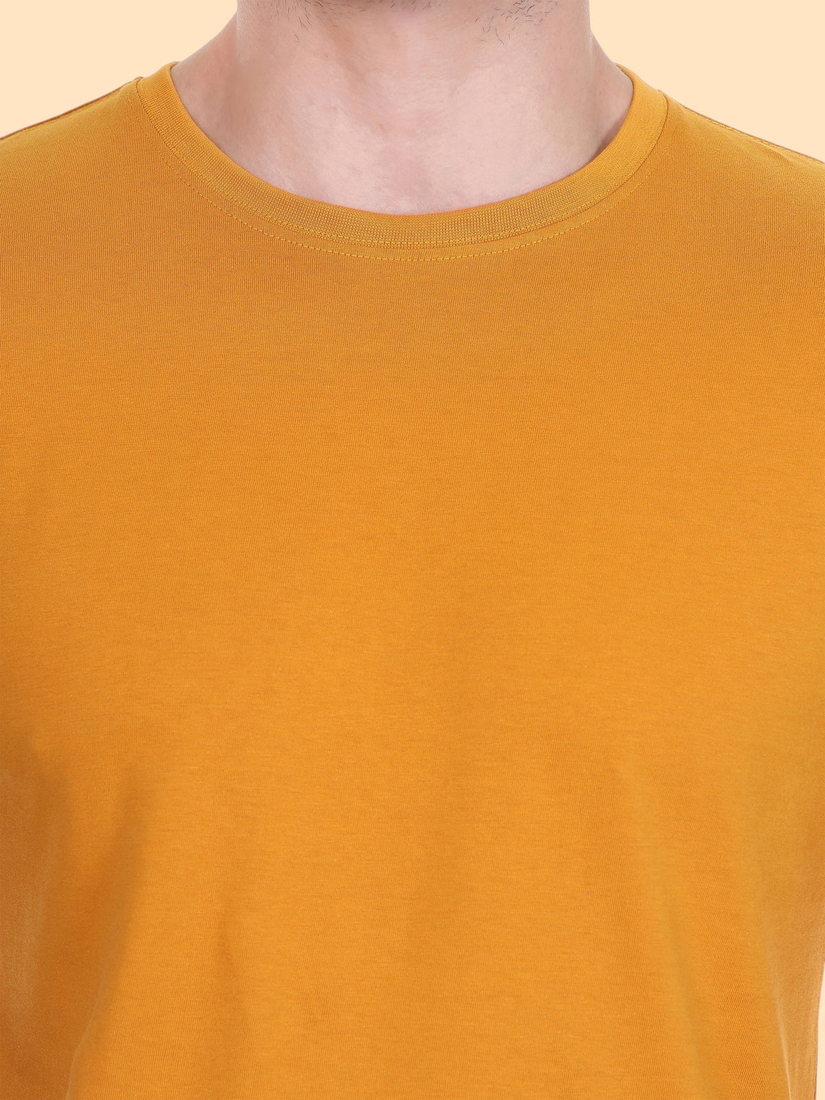 Close-up of the enaay.com mustard yellow round neck t-shirt made from premium 200 GSM knit fabric.