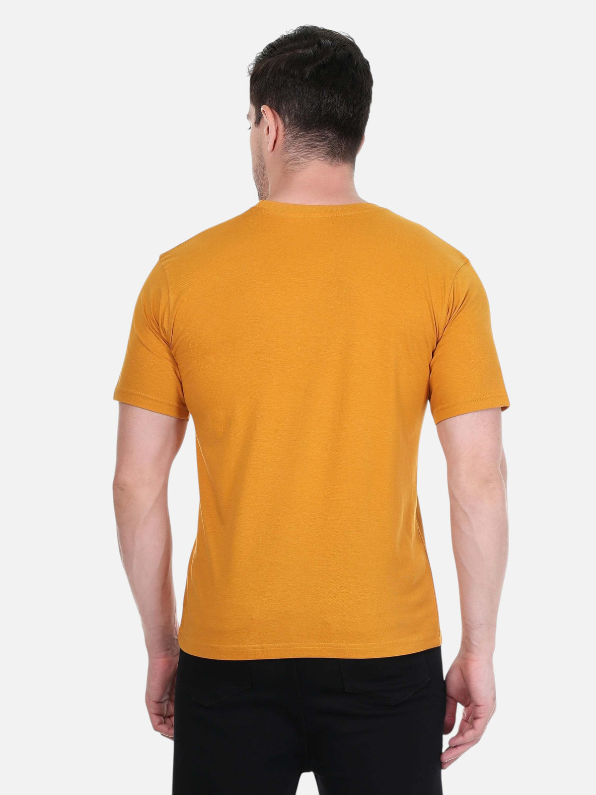 Back view of a man wearing an enaay.com mustard yellow premium cotton round neck t-shirt with short sleeves.