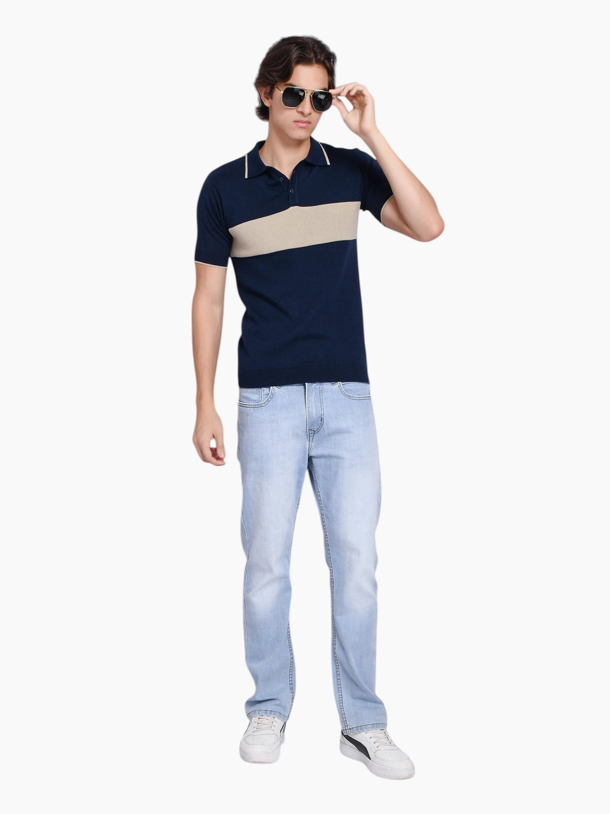 enaay.com men's navy cotton knit polo with beige chest stripe, tipped collar, and light wash jeans on a male model