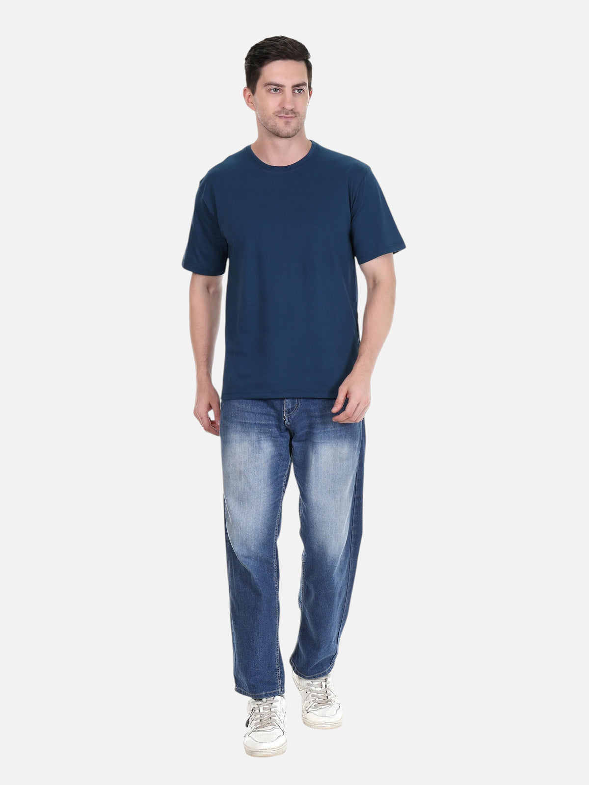 Model wearing an enaay.com navy blue premium cotton round neck t-shirt with regular fit jeans and white sneakers