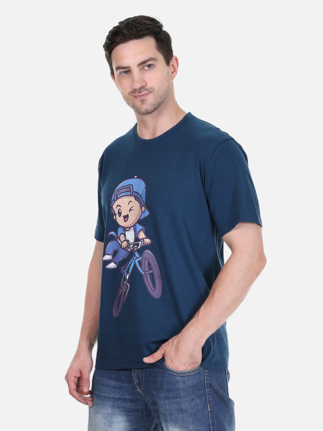 Model wearing an enaay.com navy blue cotton t-shirt featuring a playful cartoon character riding a bicycle