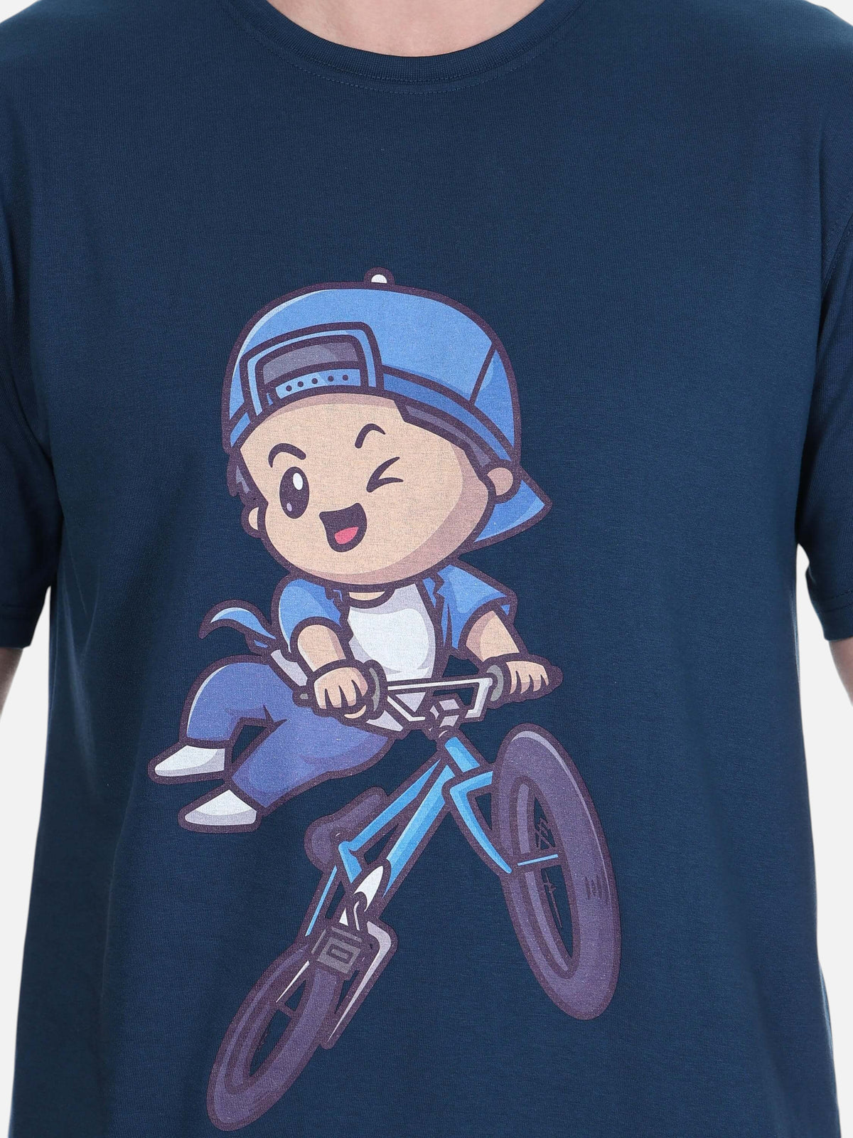 enaay.com navy blue cotton t-shirt featuring a playful cartoon character riding a bicycle in a graphic print