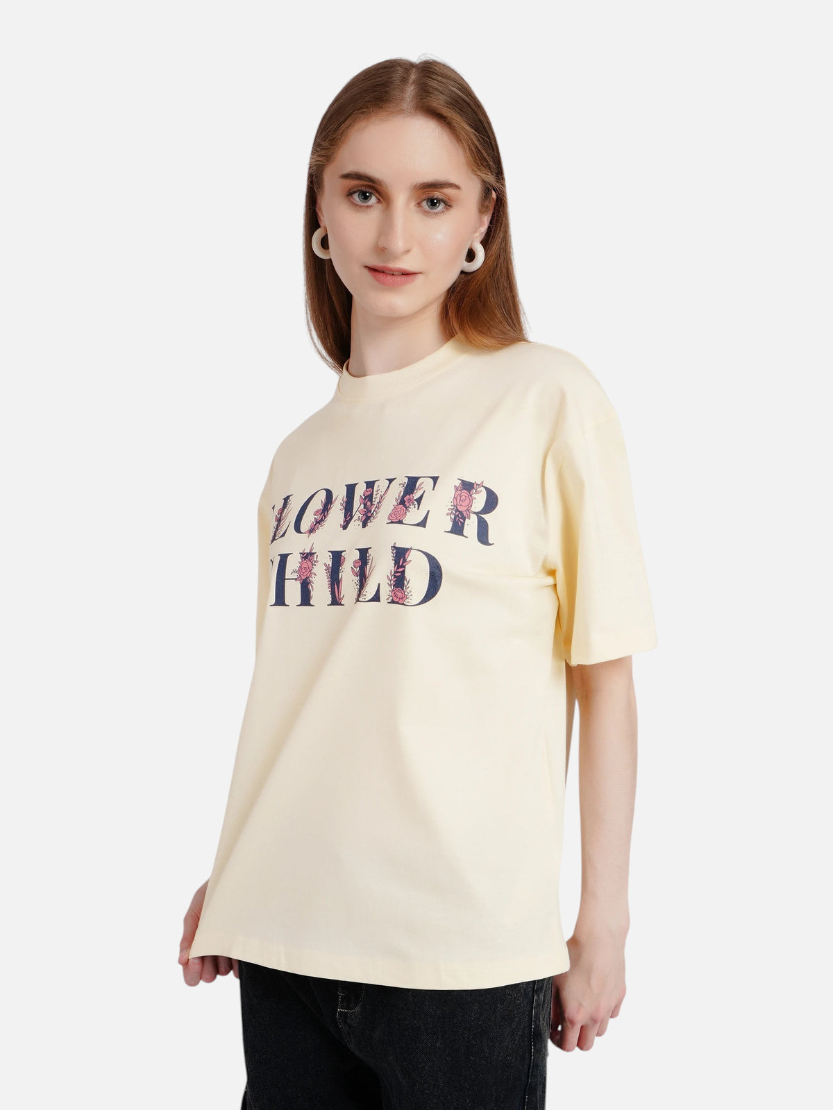 Model wearing an off-white enaay.com oversized cotton t-shirt with a floral Flower Child graphic print