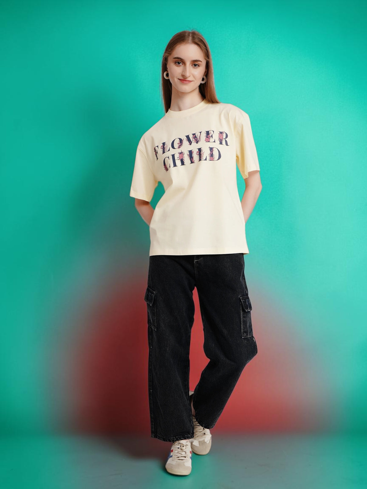 Model wearing an enaay.com off-white oversized cotton t-shirt with a vintage-style Flower Child graphic print.