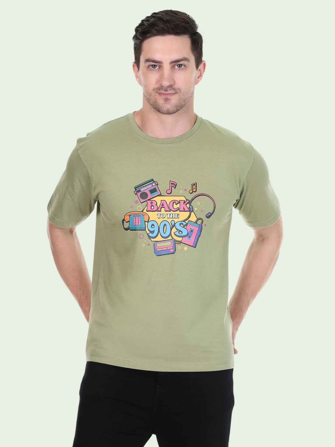 Model wearing an olive green enaay.com cotton t-shirt with a colourful 90s retro boombox and cassette graphic print
