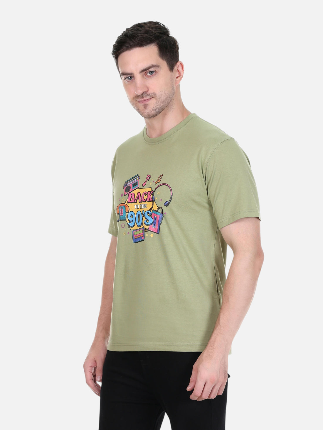 Model wearing an olive green enaay.com cotton t-shirt with a colourful 90s retro boombox and cassette graphic print