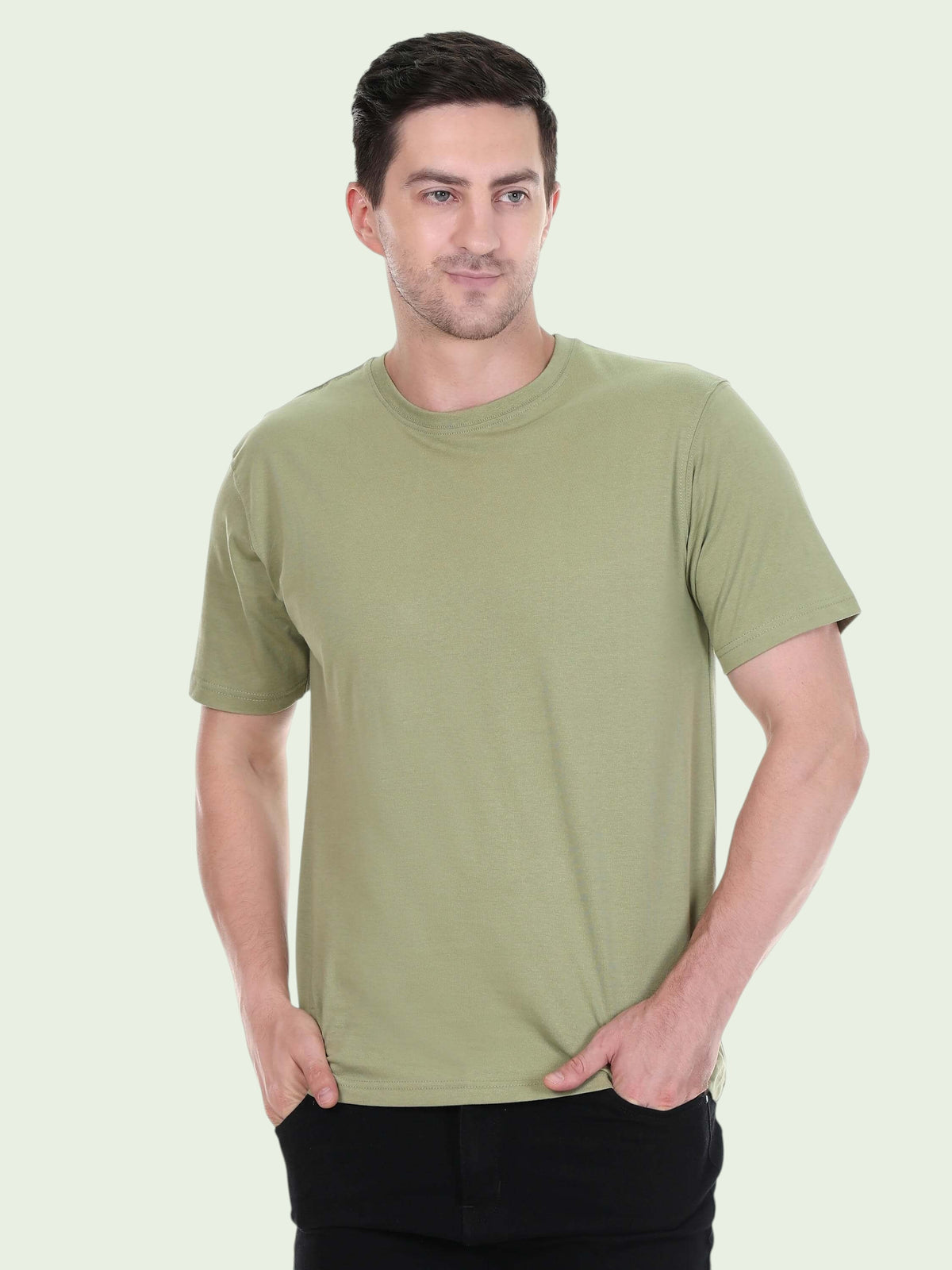 A man wearing an enaay.com olive green premium cotton round neck t-shirt with short sleeves and a regular fit.
