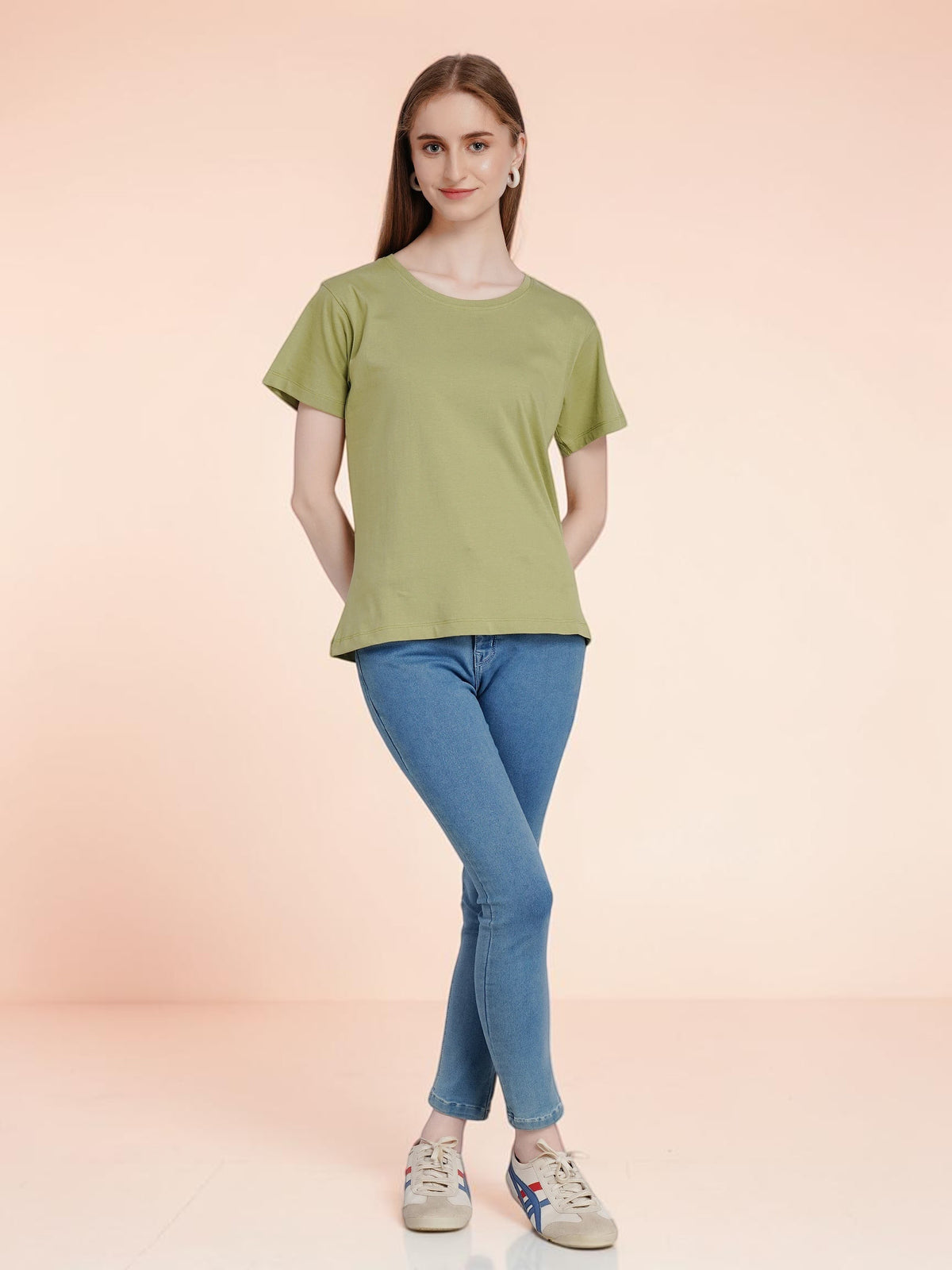 enaay.com women's solid olive green cotton t-shirt with round neck and short sleeves worn with blue jeans